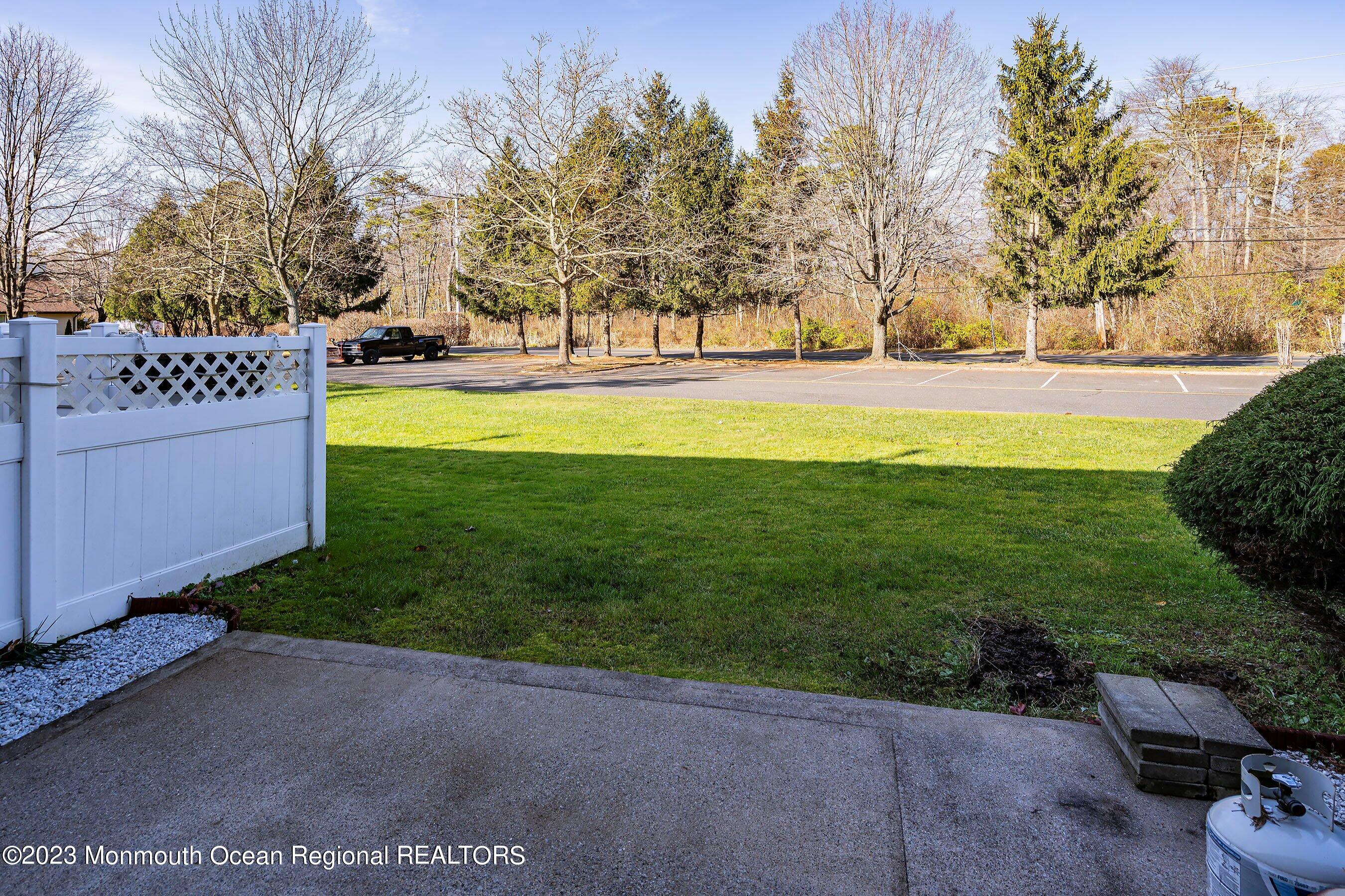 1012 Sawmill Road, Unit 6 Brick, NJ 08724 - Photo 22 of 24 a view of yard with green space and trees