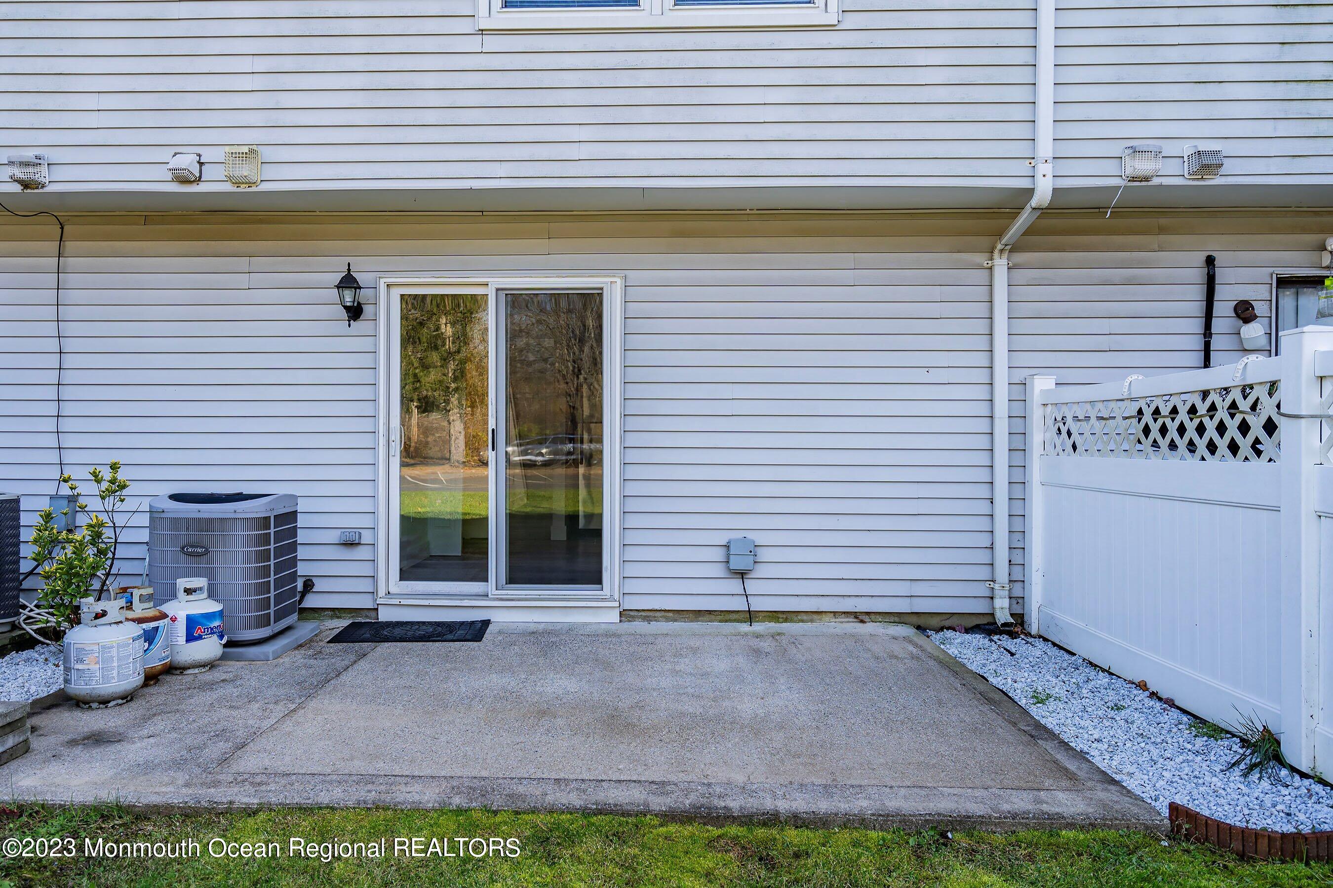 1012 Sawmill Road, Unit 6 Brick, NJ 08724 - Photo 23 of 24 a view of a house with backyard and plants