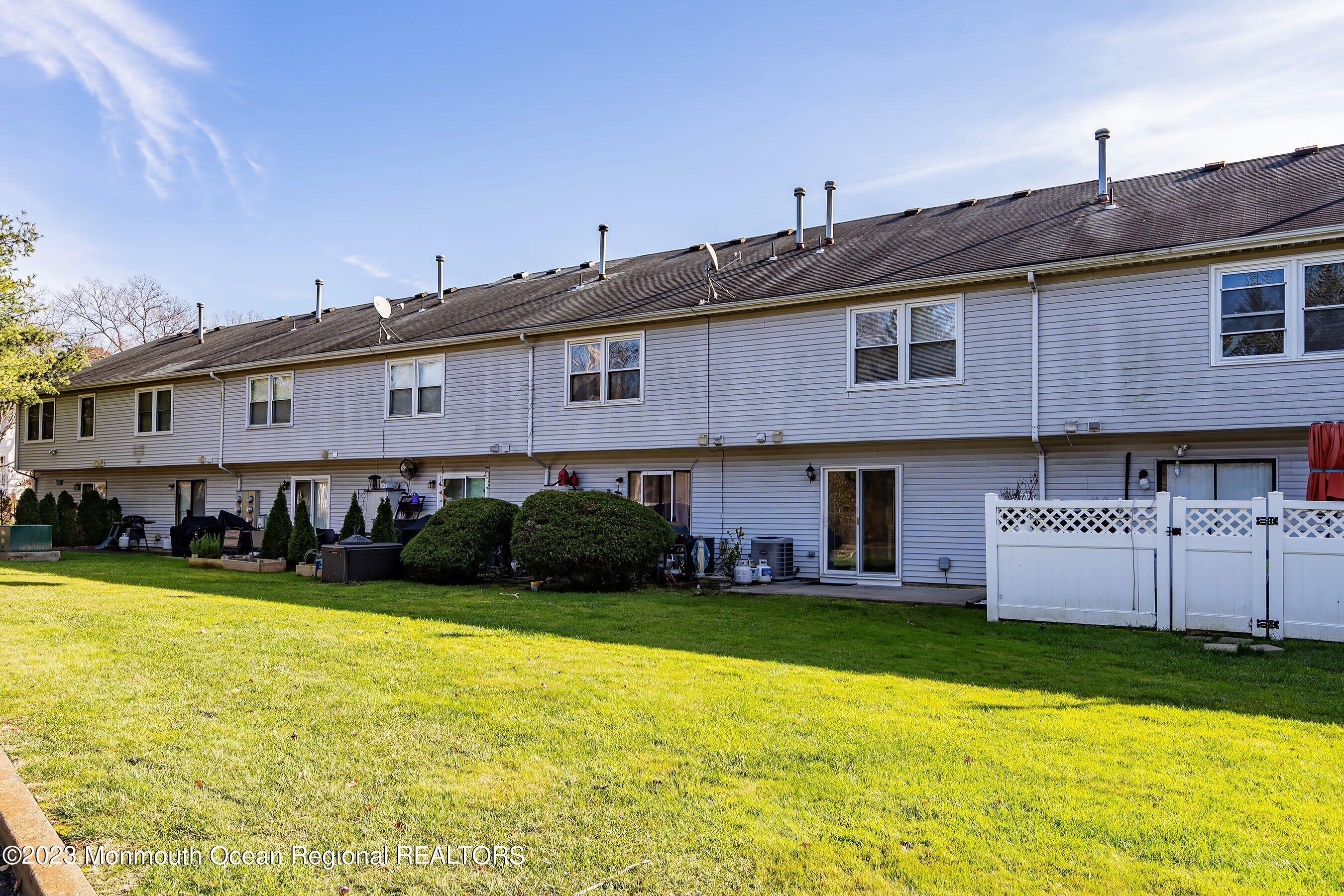 1012 Sawmill Road, Unit 6 Brick, NJ 08724 - Photo 24 of 24 a front view of a building with garden