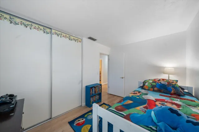 a bedroom with a bed and a dresser