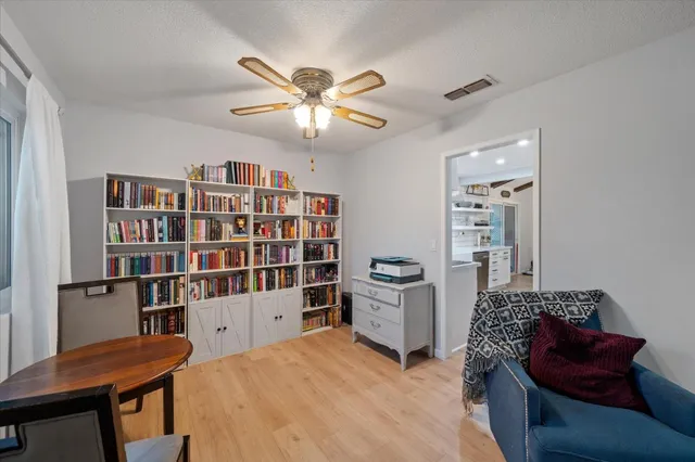 a view of a livingroom with furniture and staircase