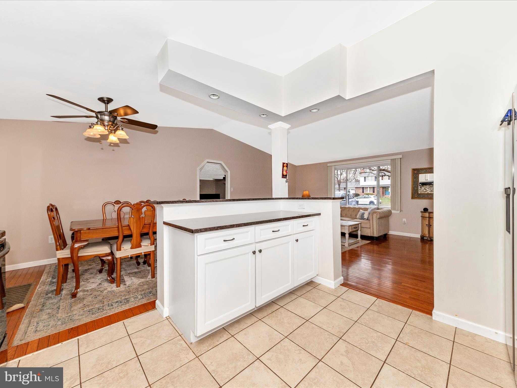 19005 Dowden Circle Poolesville, MD 20837 - Photo 13 of 51 a kitchen with a sink cabinets and dining table