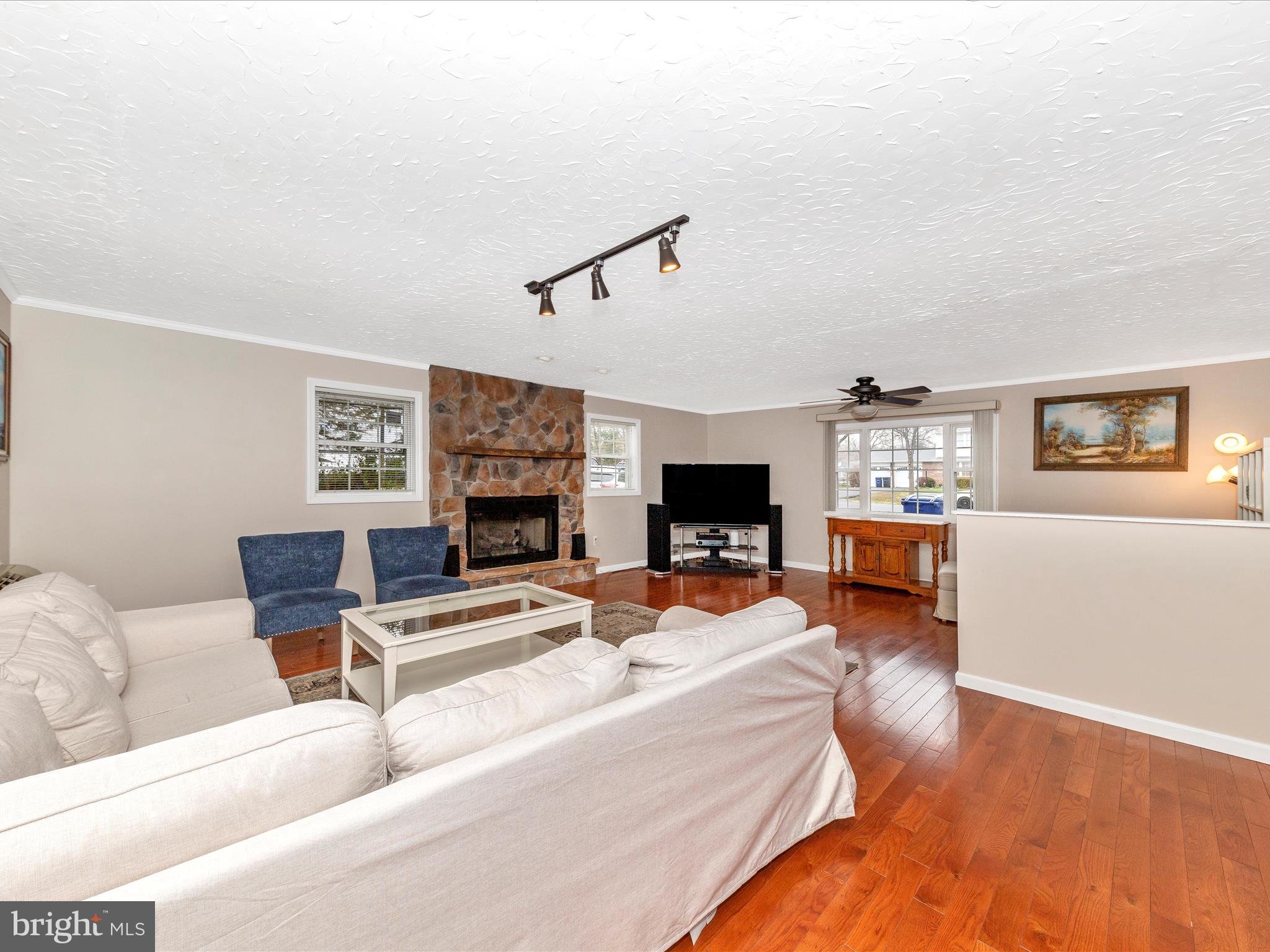 19005 Dowden Circle Poolesville, MD 20837 - Photo 14 of 51 a living room with furniture and a flat screen tv