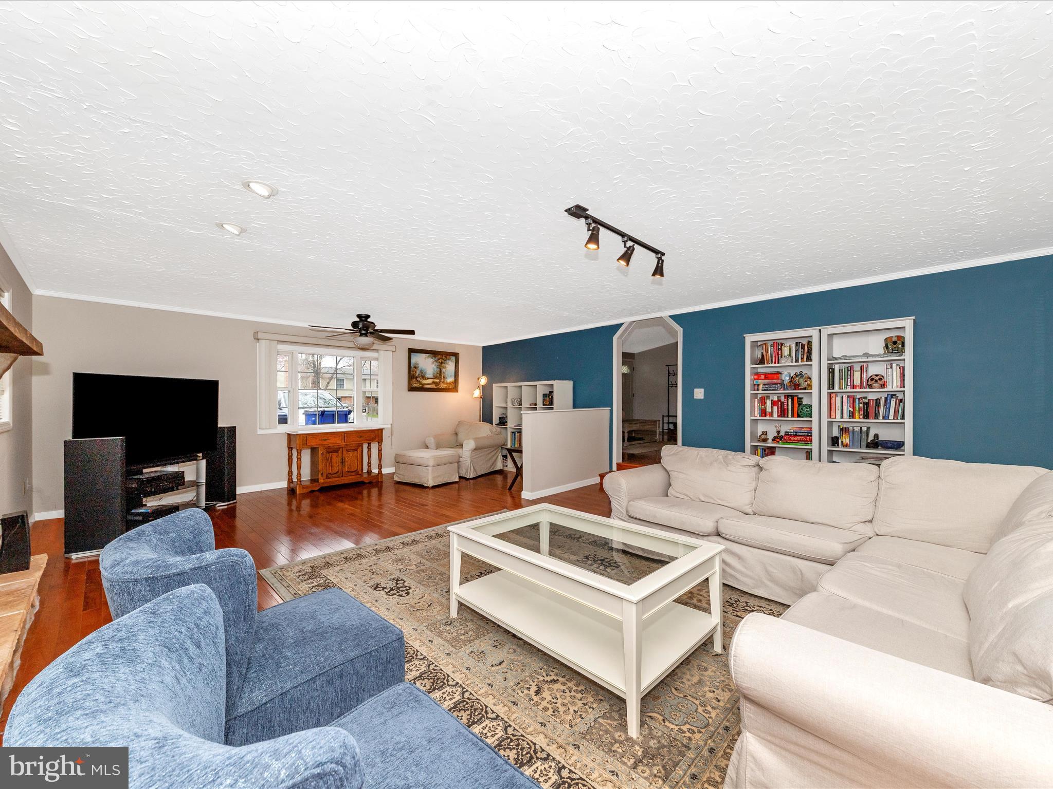 19005 Dowden Circle Poolesville, MD 20837 - Photo 15 of 51 a living room with furniture and a flat screen tv