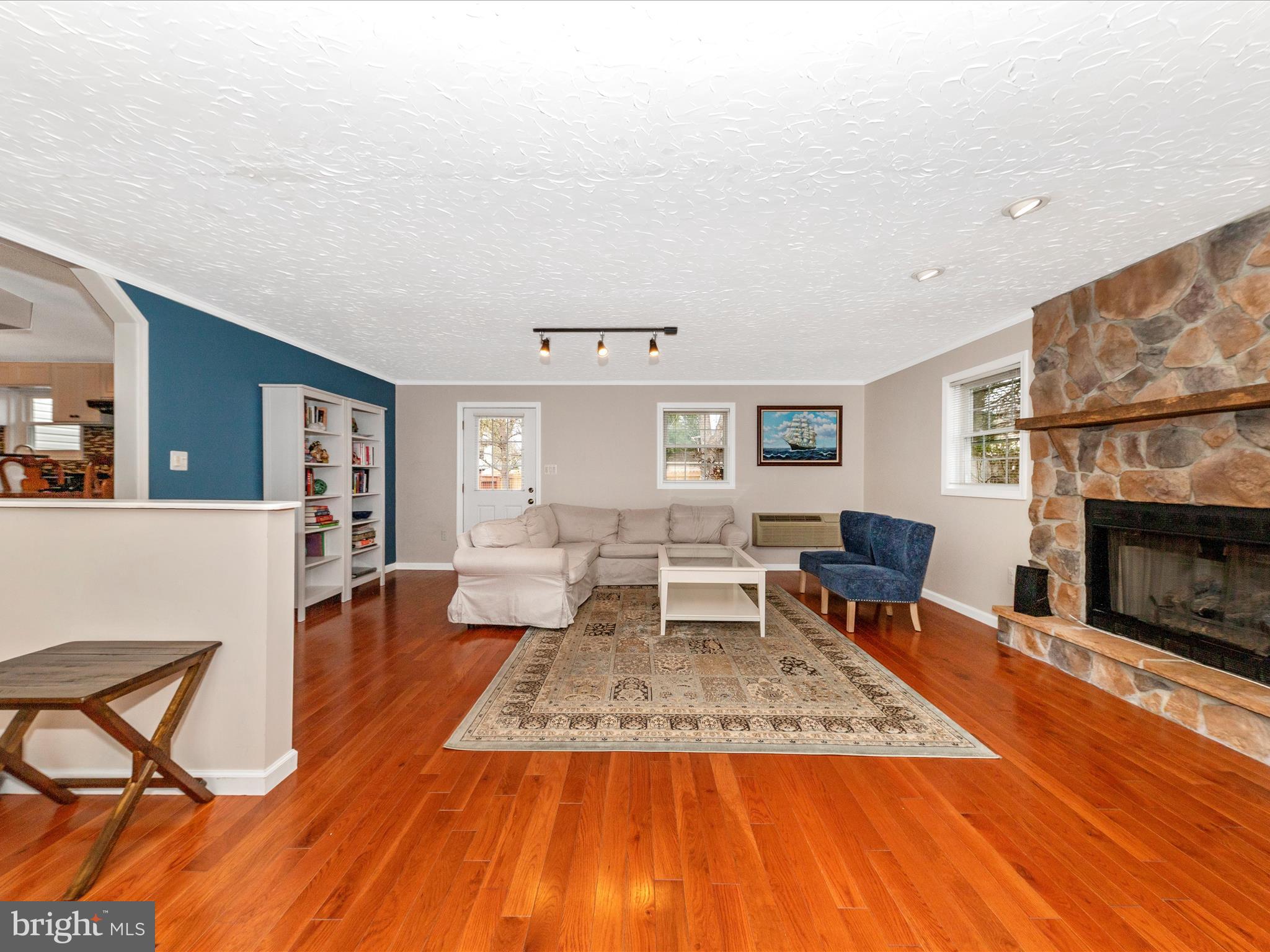 19005 Dowden Circle Poolesville, MD 20837 - Photo 16 of 51 a living room with furniture and a fireplace