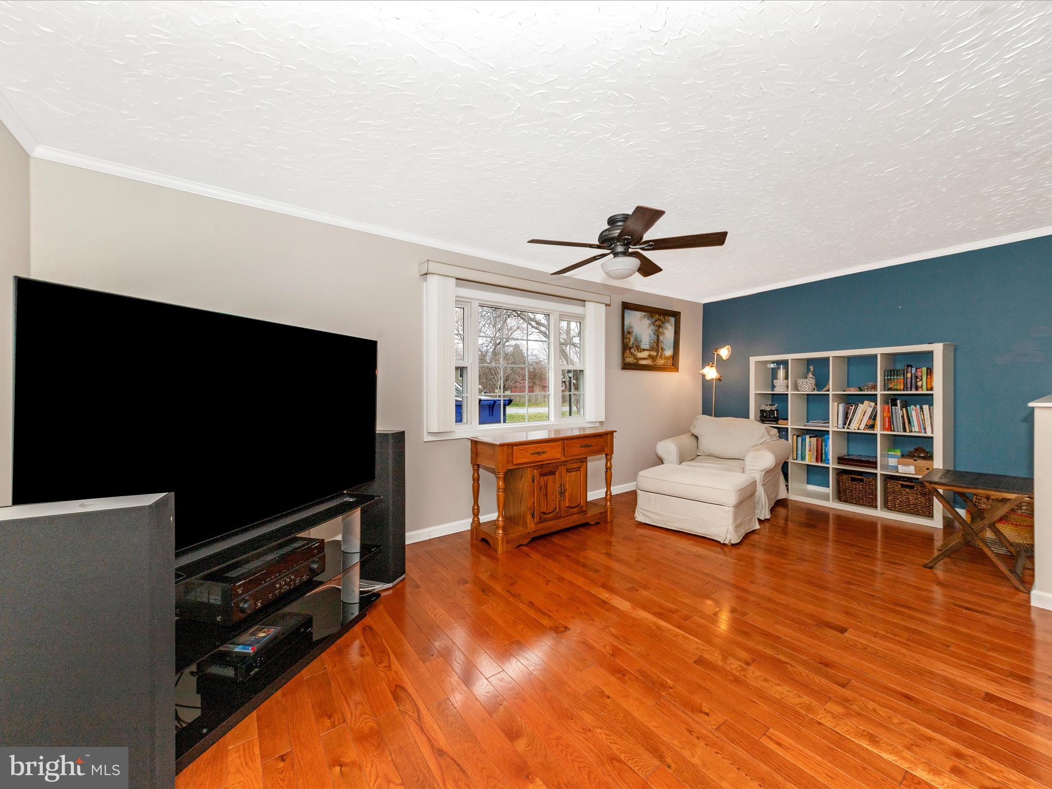 19005 Dowden Circle Poolesville, MD 20837 - Photo 18 of 51 a living room with furniture and a flat screen tv