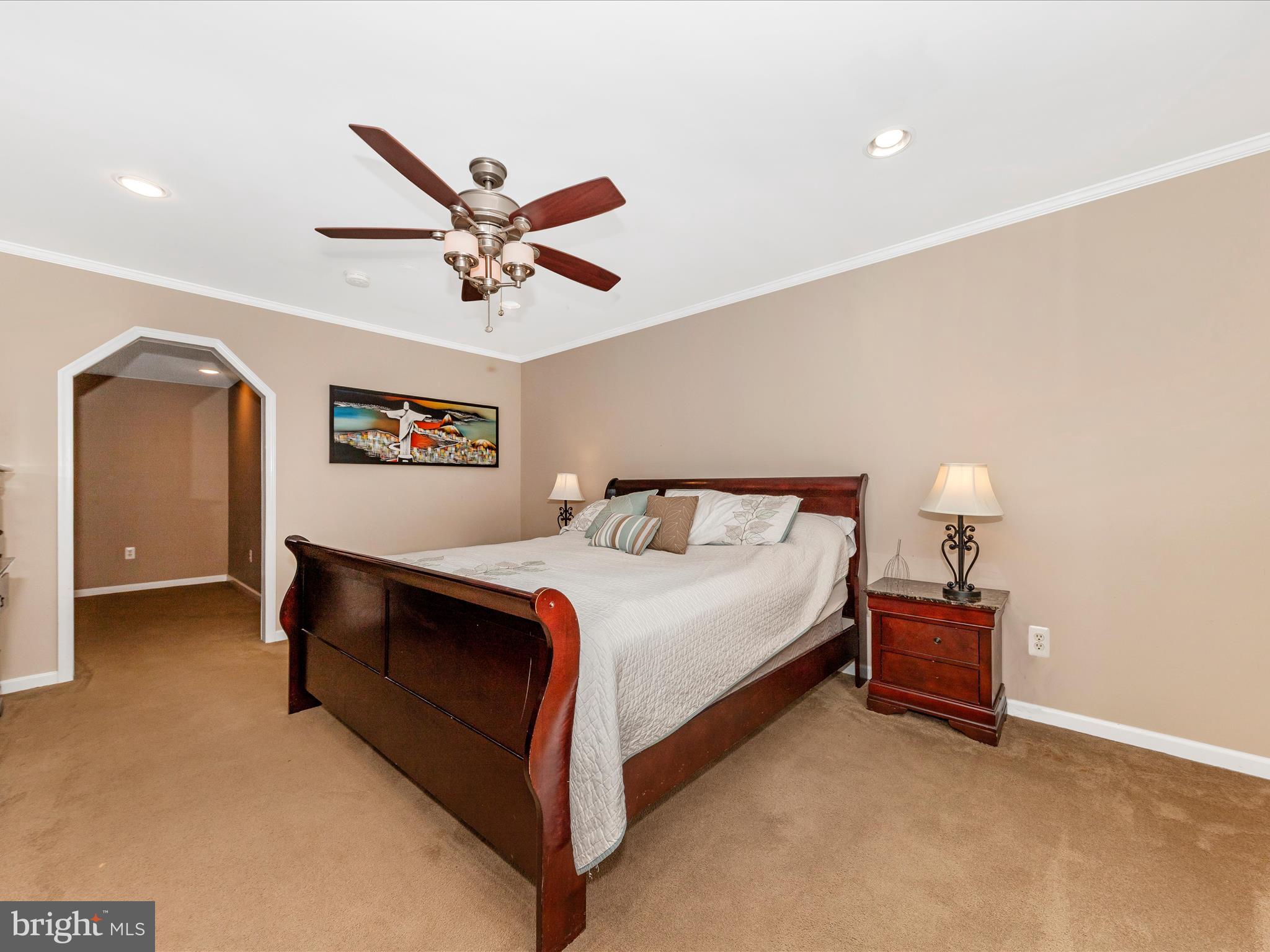 19005 Dowden Circle Poolesville, MD 20837 - Photo 21 of 51 a bedroom with a bed and a ceiling fan