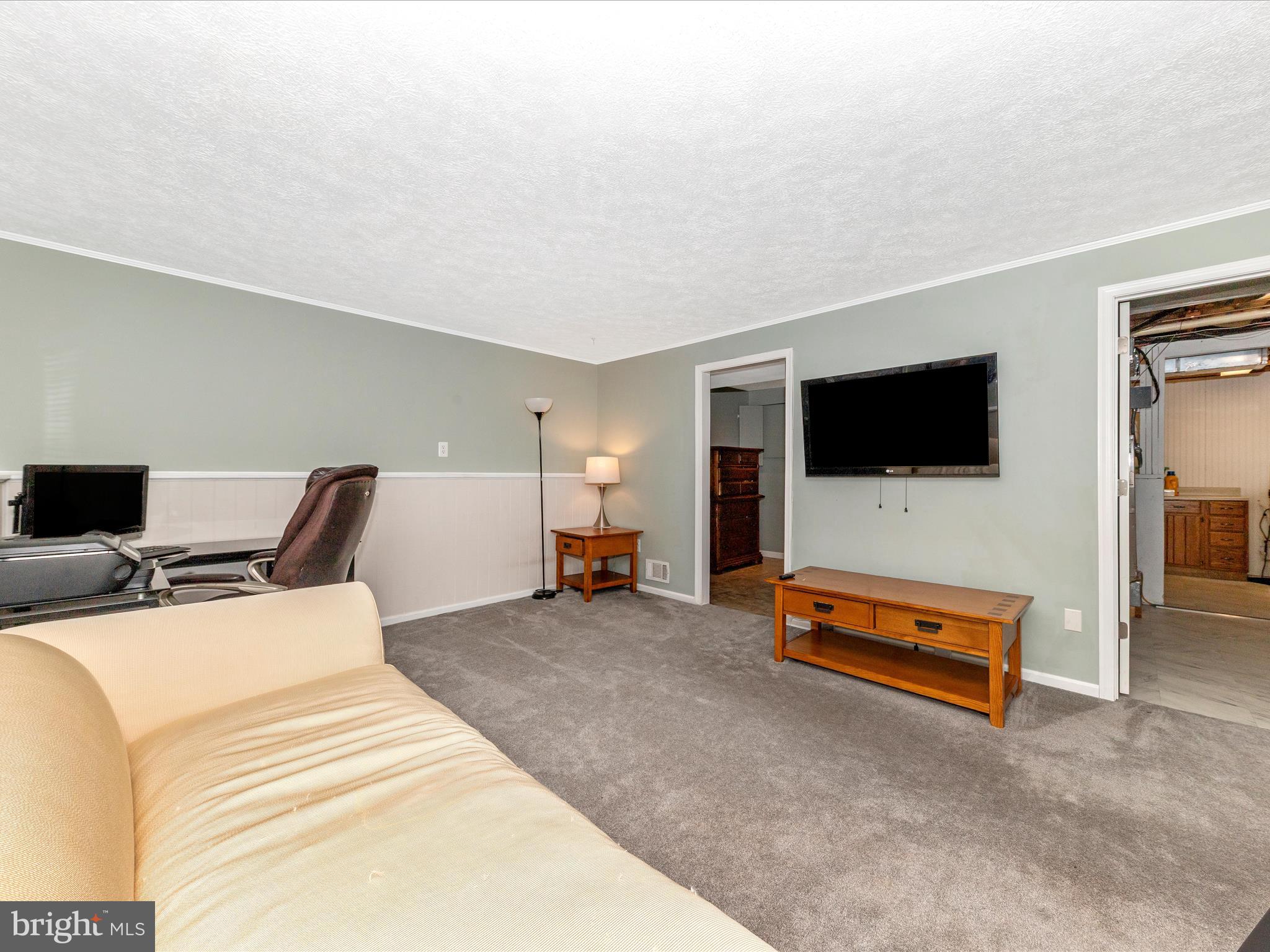 19005 Dowden Circle Poolesville, MD 20837 - Photo 31 of 51 a bed room with a bed and a television