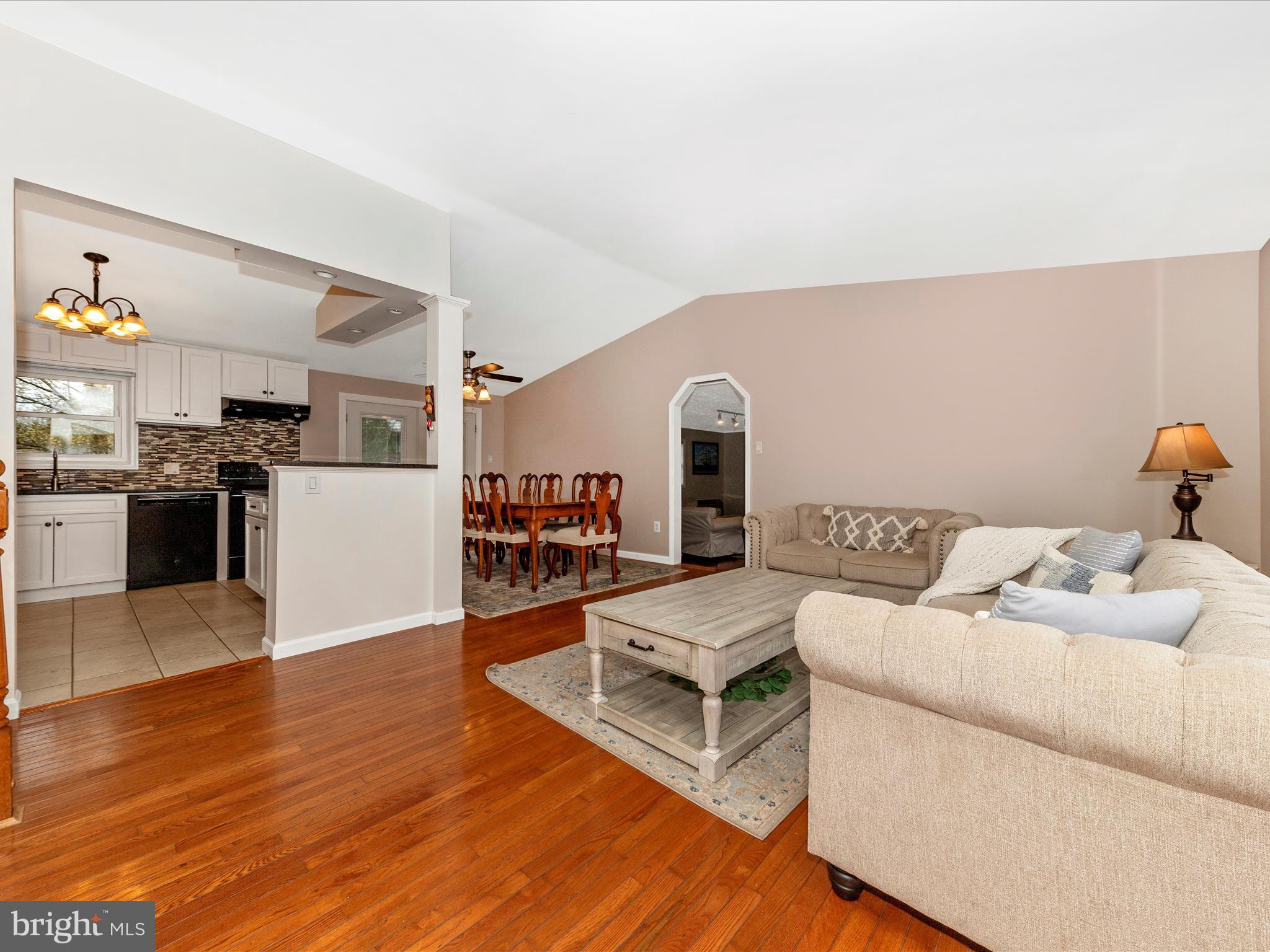 19005 Dowden Circle Poolesville, MD 20837 - Photo 4 of 51 a living room with furniture and kitchen view