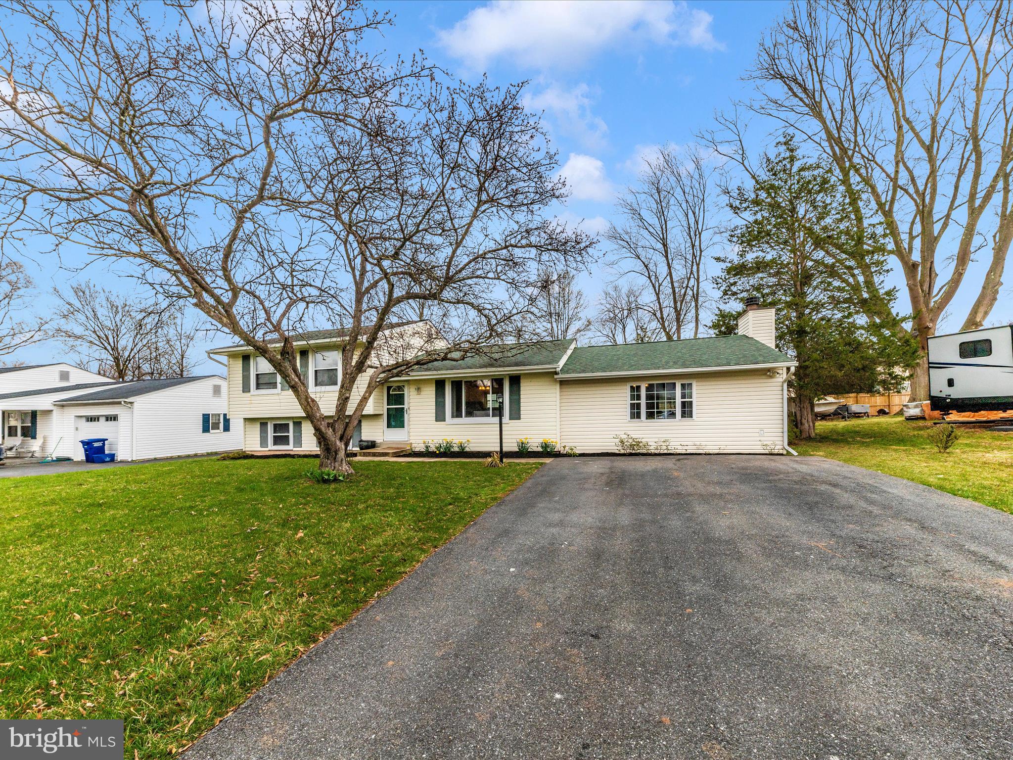 19005 Dowden Circle Poolesville, MD 20837 - Photo 41 of 51 a view of a house with a yard and large tree
