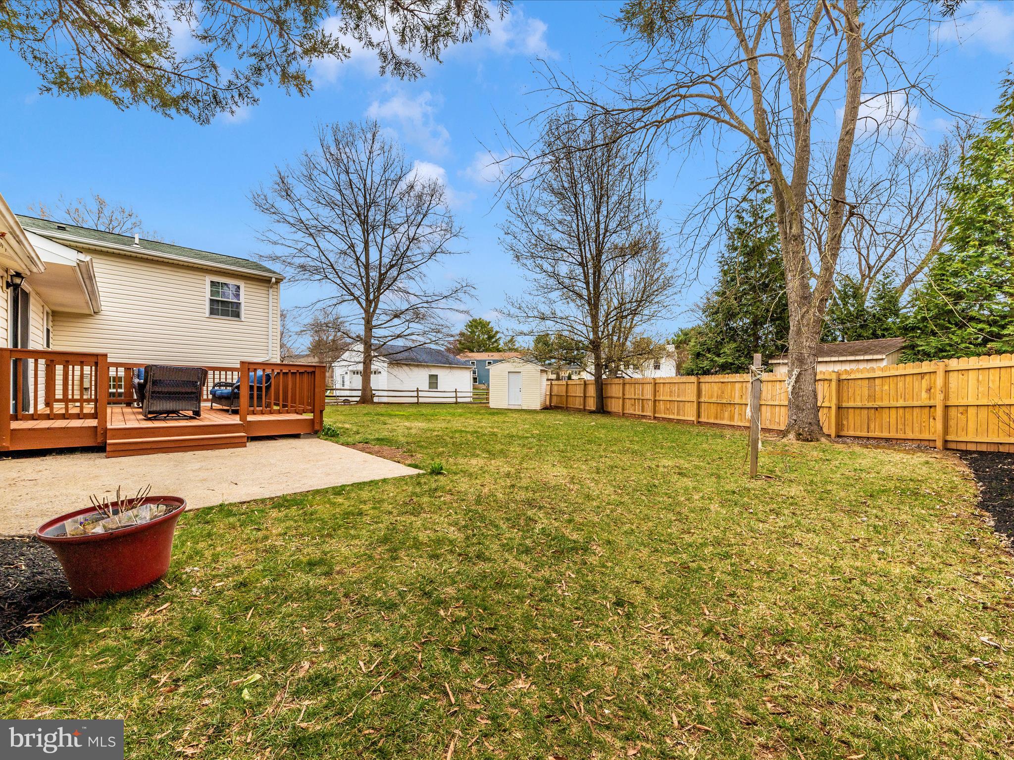 19005 Dowden Circle Poolesville, MD 20837 - Photo 46 of 51 a view of a yard with table and chairs and a fire pit