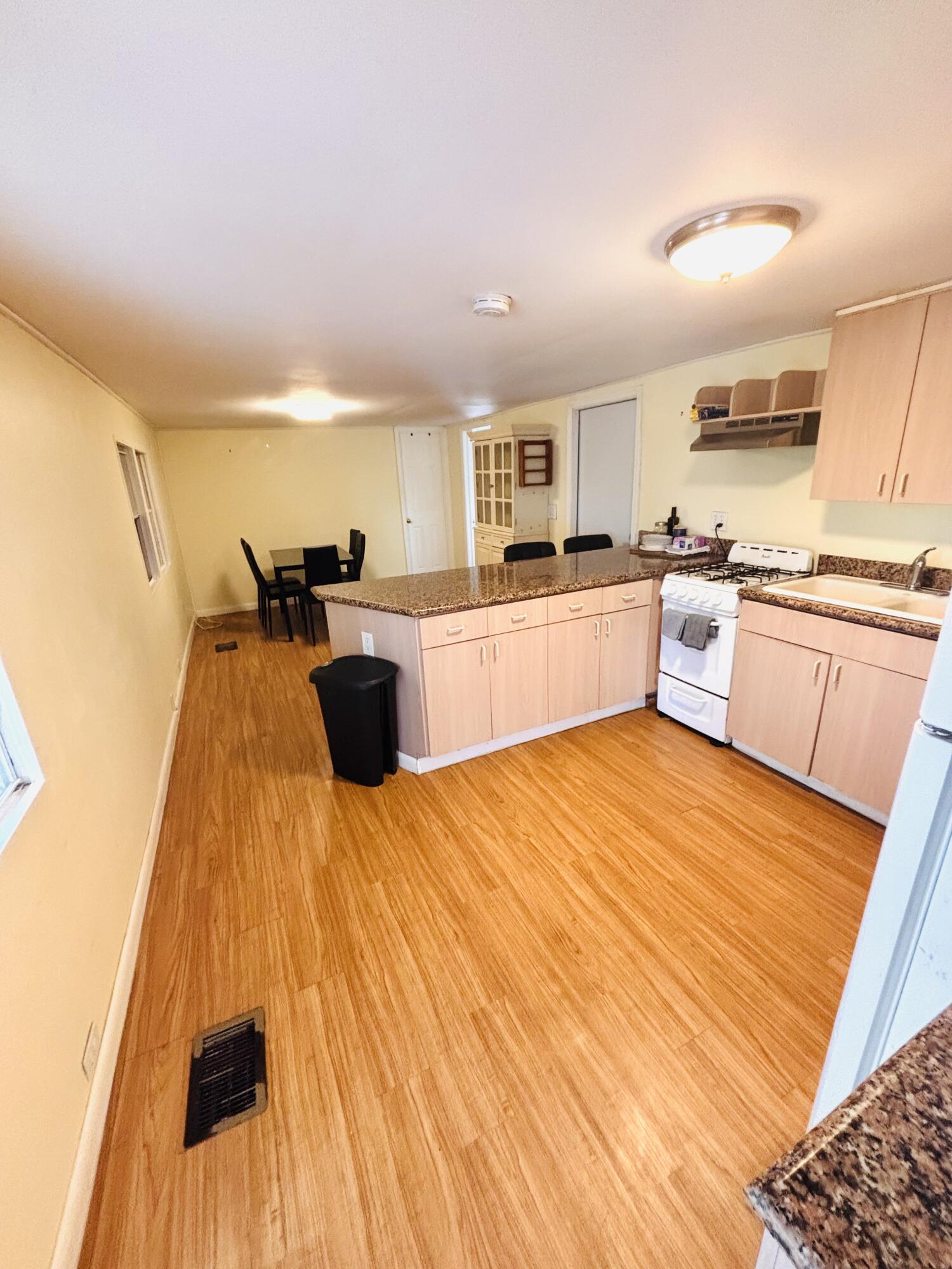 47 Boundary Lane Key West, FL 33040 - Photo 5 of 16 a large kitchen with a lot of counter space and wooden floor