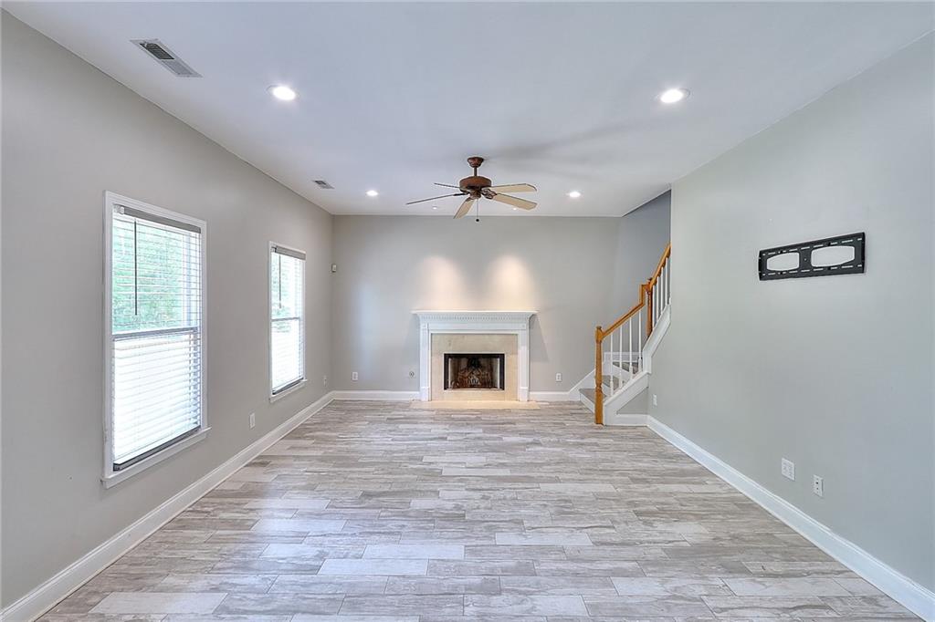 2520 Potomac View Court Grayson, GA 30017 - Photo 14 of 32 a view of an empty room with a window and fireplace