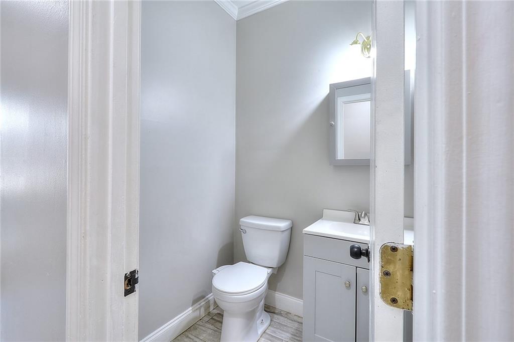 2520 Potomac View Court Grayson, GA 30017 - Photo 15 of 32 a white toilet sitting next to a bathroom sink