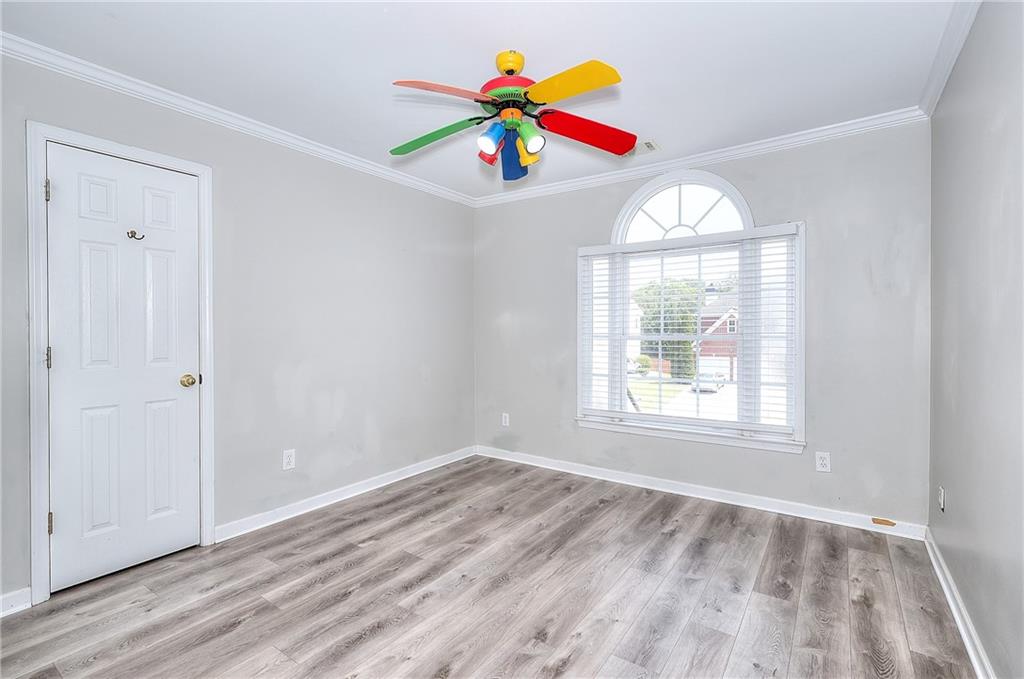 2520 Potomac View Court Grayson, GA 30017 - Photo 24 of 32 wooden floor in an empty room with a window