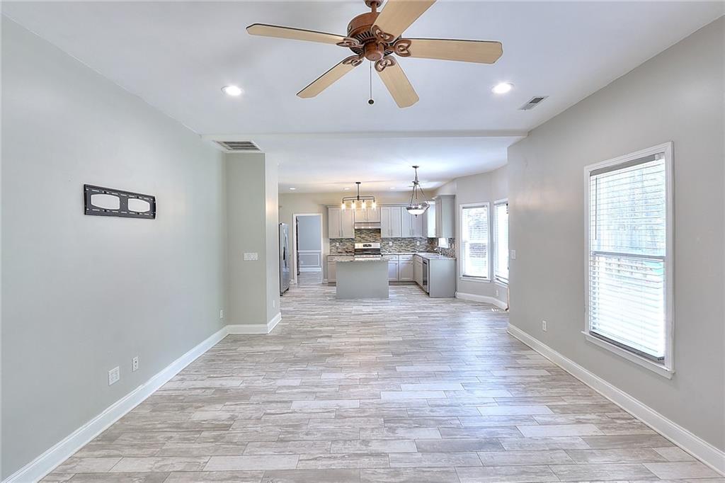 2520 Potomac View Court Grayson, GA 30017 - Photo 3 of 32 a large room with chandelier fan and windows