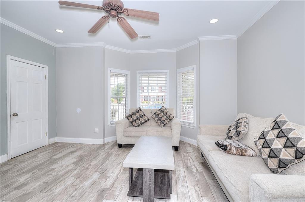 2520 Potomac View Court Grayson, GA 30017 - Photo 9 of 32 a living room with furniture and a large window