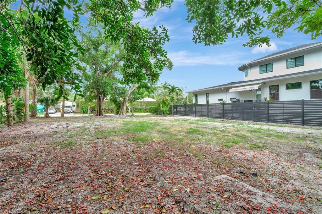 Carlton Avenue Naples, FL 34112 - Photo 13 of 22 a view of a house with a yard