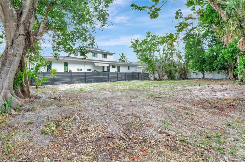 Carlton Avenue Naples, FL 34112 - Photo 14 of 22 a view of a house with a yard
