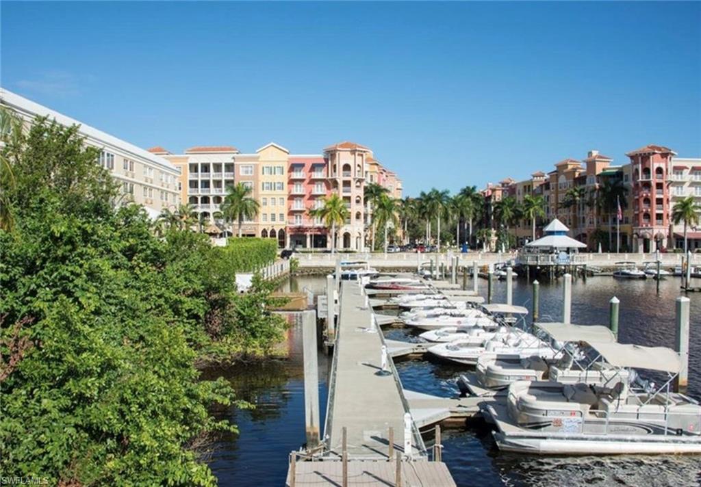 Carlton Avenue Naples, FL 34112 - Photo 21 of 22 a view of a lake with tall buildings