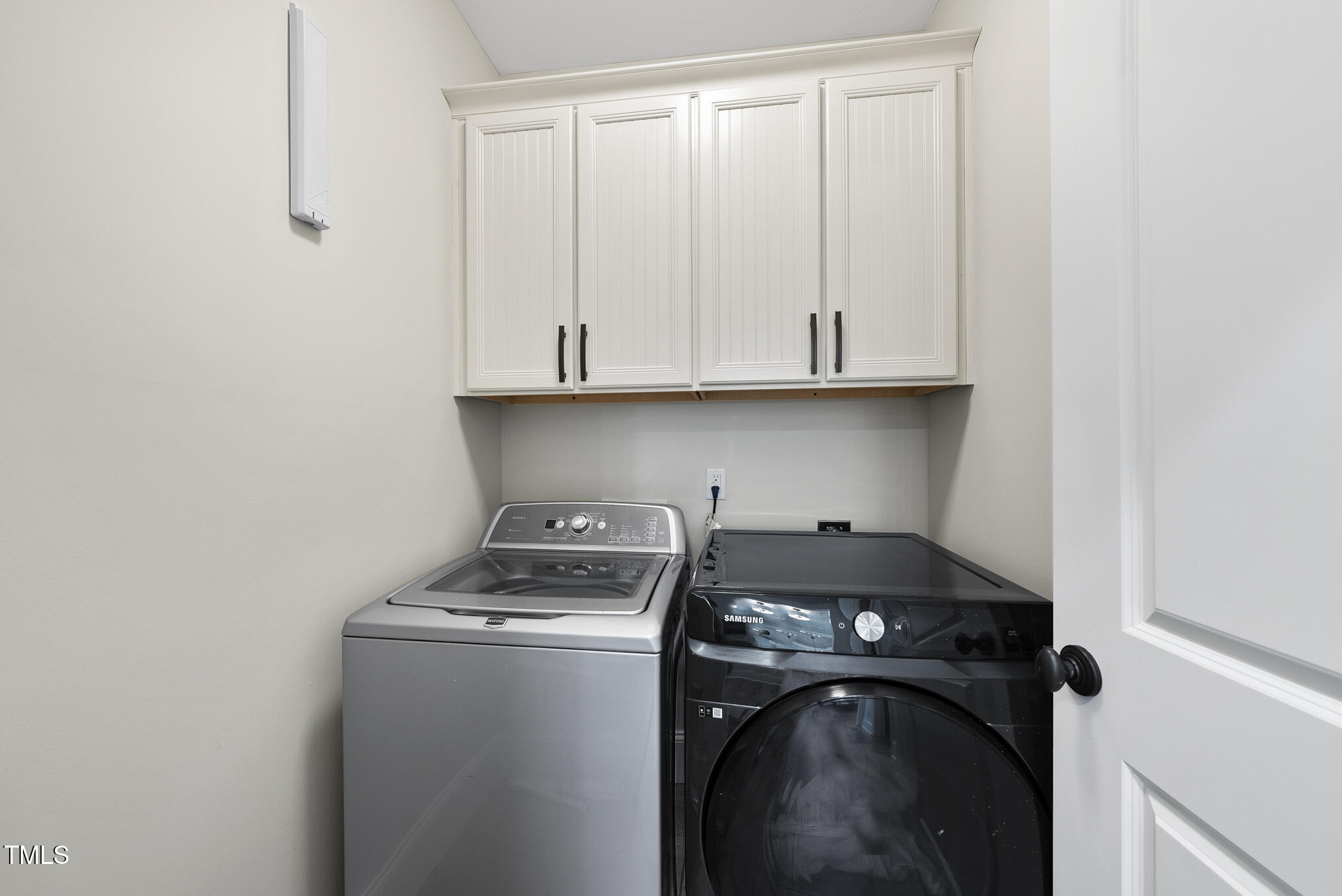 2216 Gresham Lake Road Raleigh, NC 27615 - Photo 15 of 52 a view of storage and utility room with washer and dryer