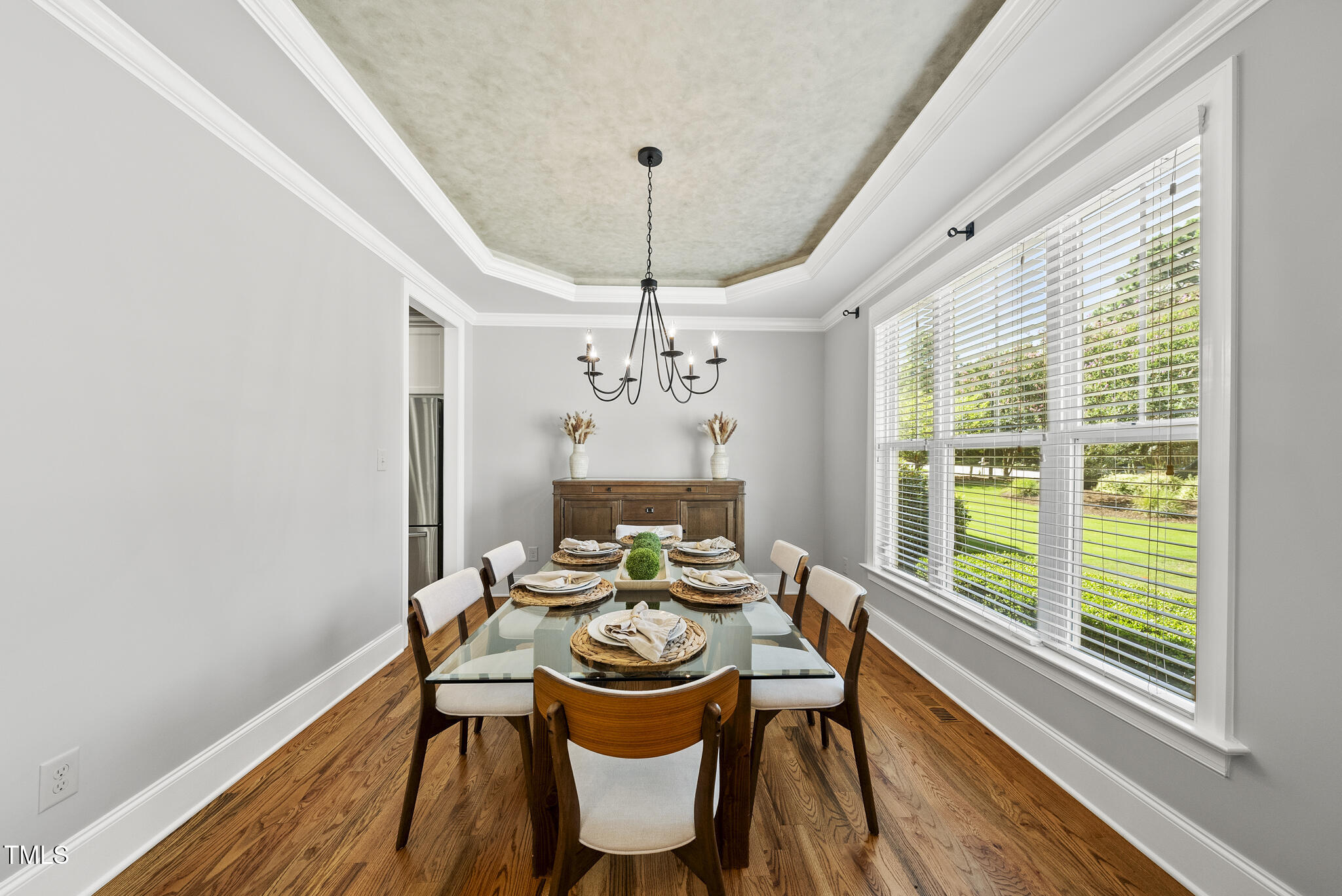 2216 Gresham Lake Road Raleigh, NC 27615 - Photo 17 of 52 a view of a dining room with furniture window and wooden floor