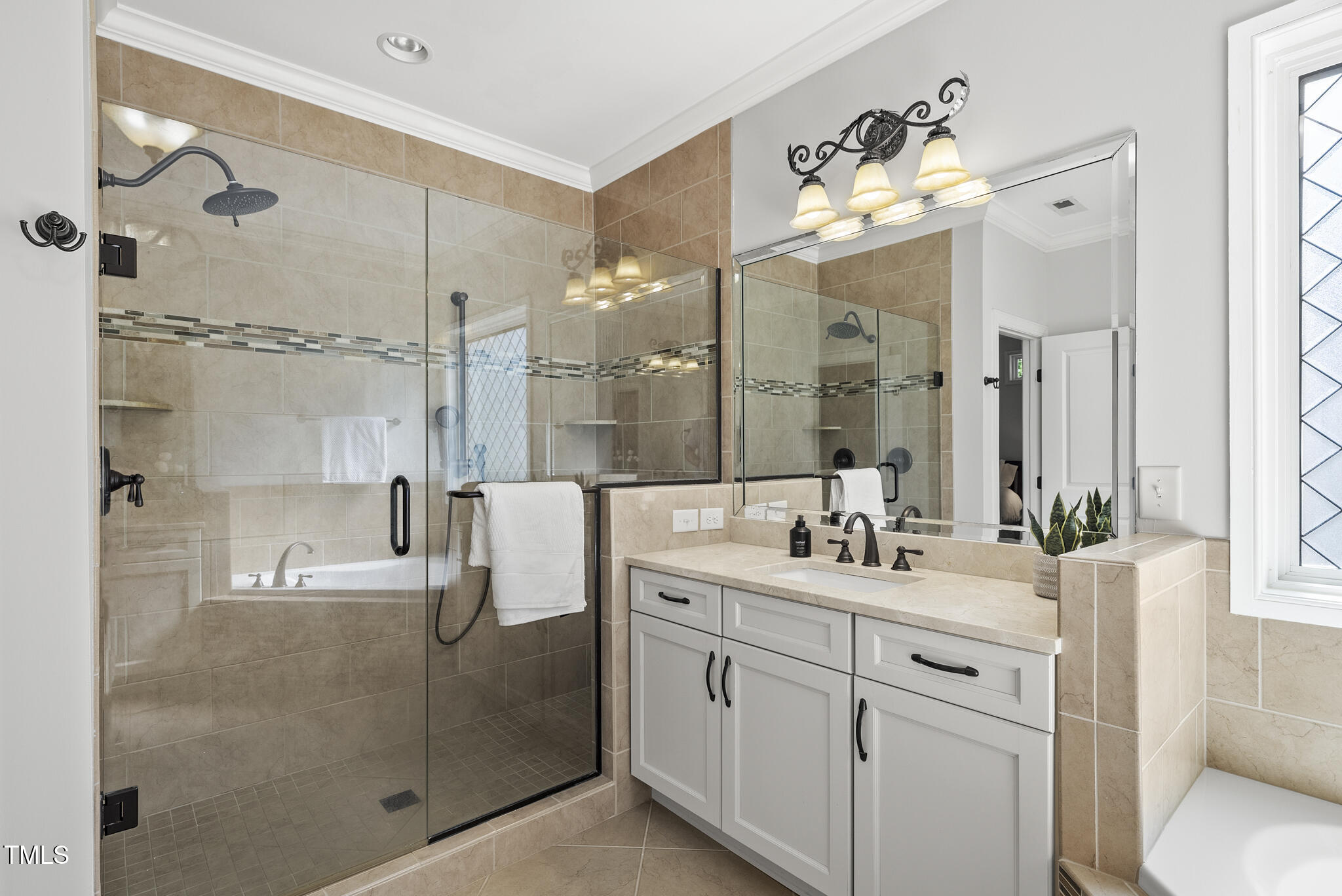 2216 Gresham Lake Road Raleigh, NC 27615 - Photo 33 of 52 a bathroom with a double vanity sink mirror and shower