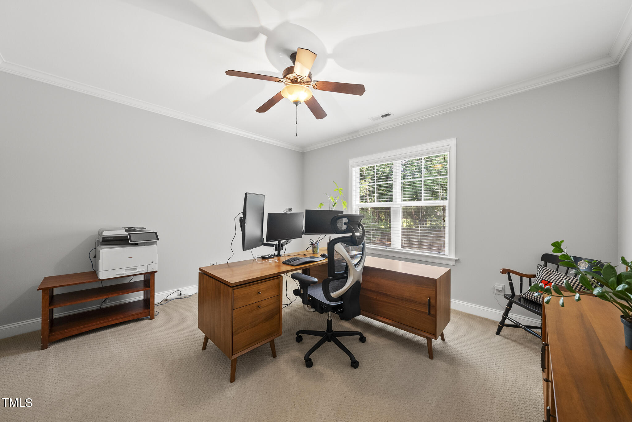 2216 Gresham Lake Road Raleigh, NC 27615 - Photo 40 of 52 a view of a workspace with furniture and a window