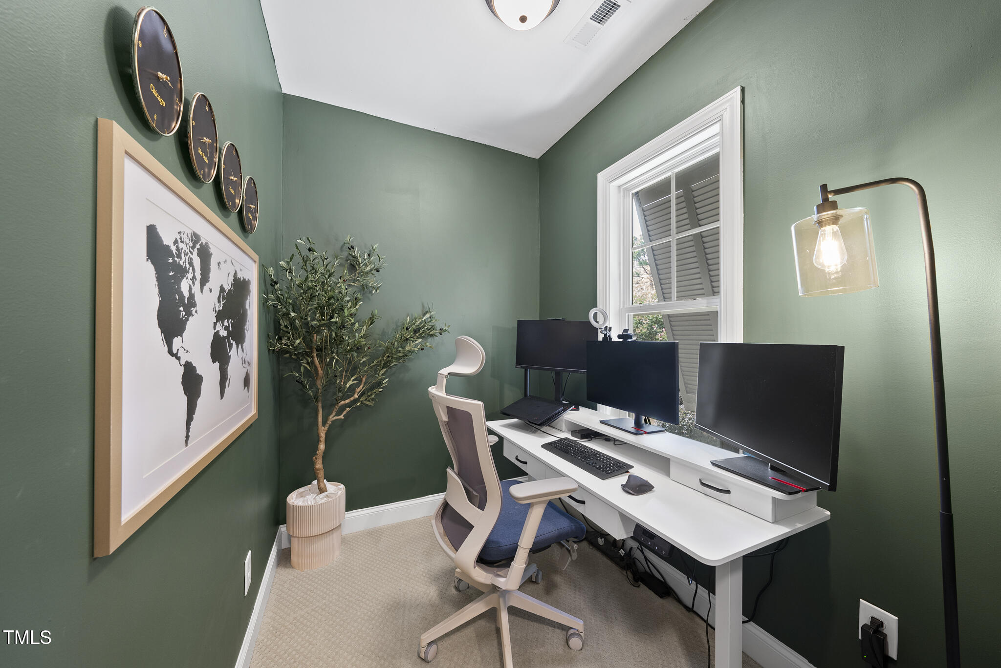 2216 Gresham Lake Road Raleigh, NC 27615 - Photo 41 of 52 a view of a workspace with furniture and a potted plant