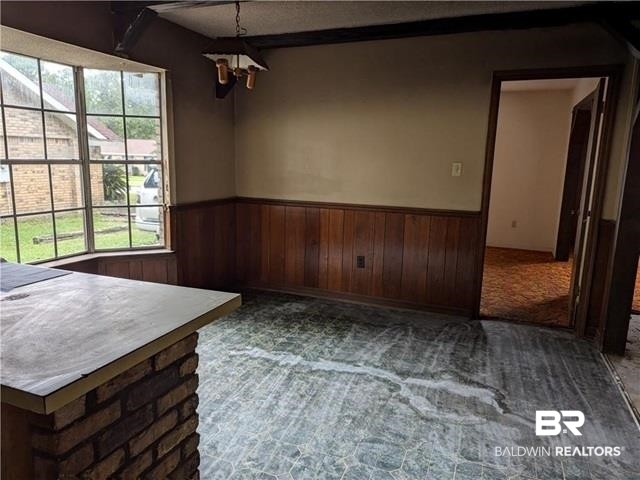 3817 Lansdowne Circle Mobile, AL 36693 - Photo 10 of 16 Carpeted spare room with wood walls