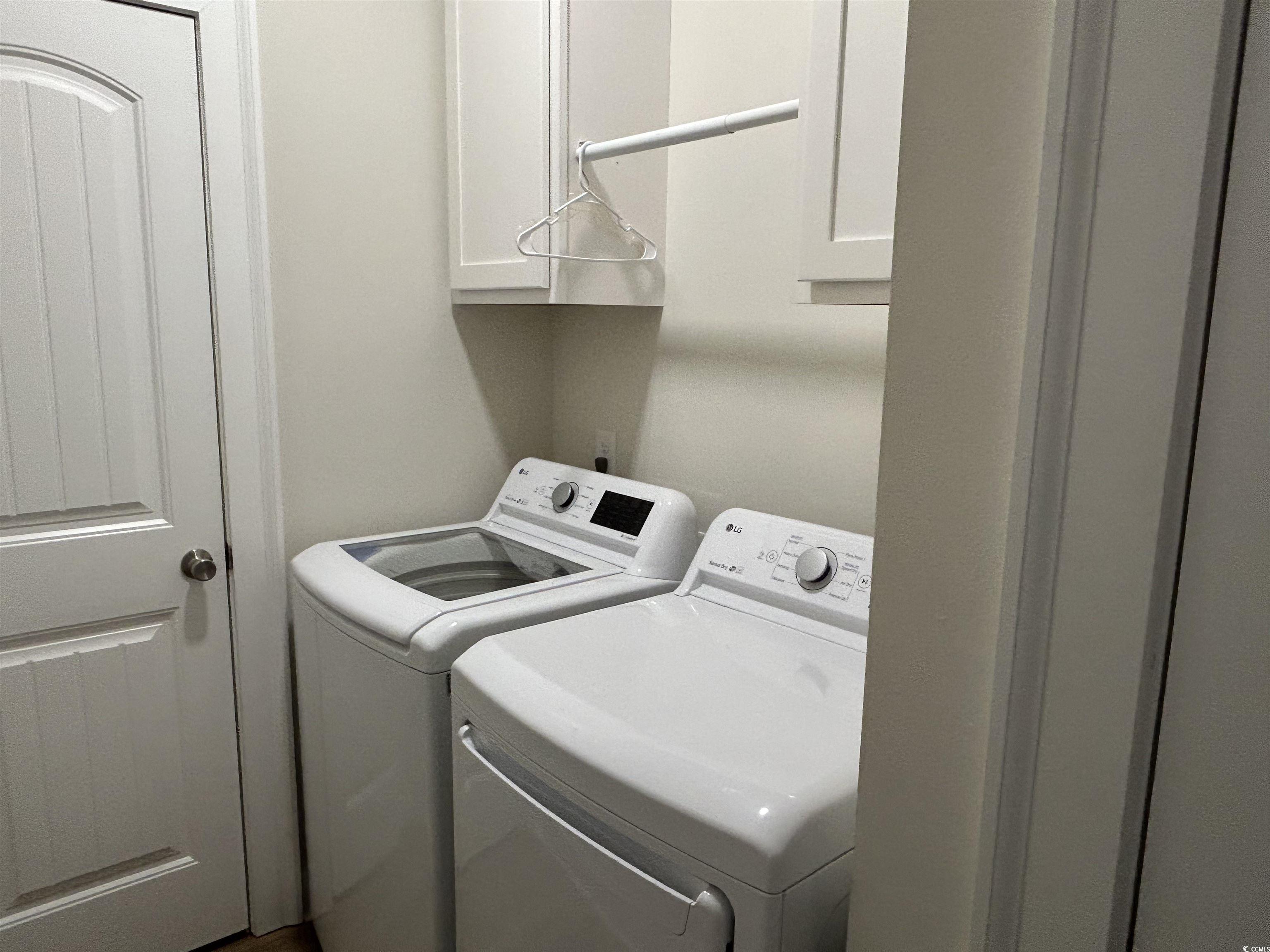 1025 Ray Costin Way, Unit 1008 Murrells Inlet, SC 29576 - Photo 26 of 36 Laundry room with washing machine and clothes drye