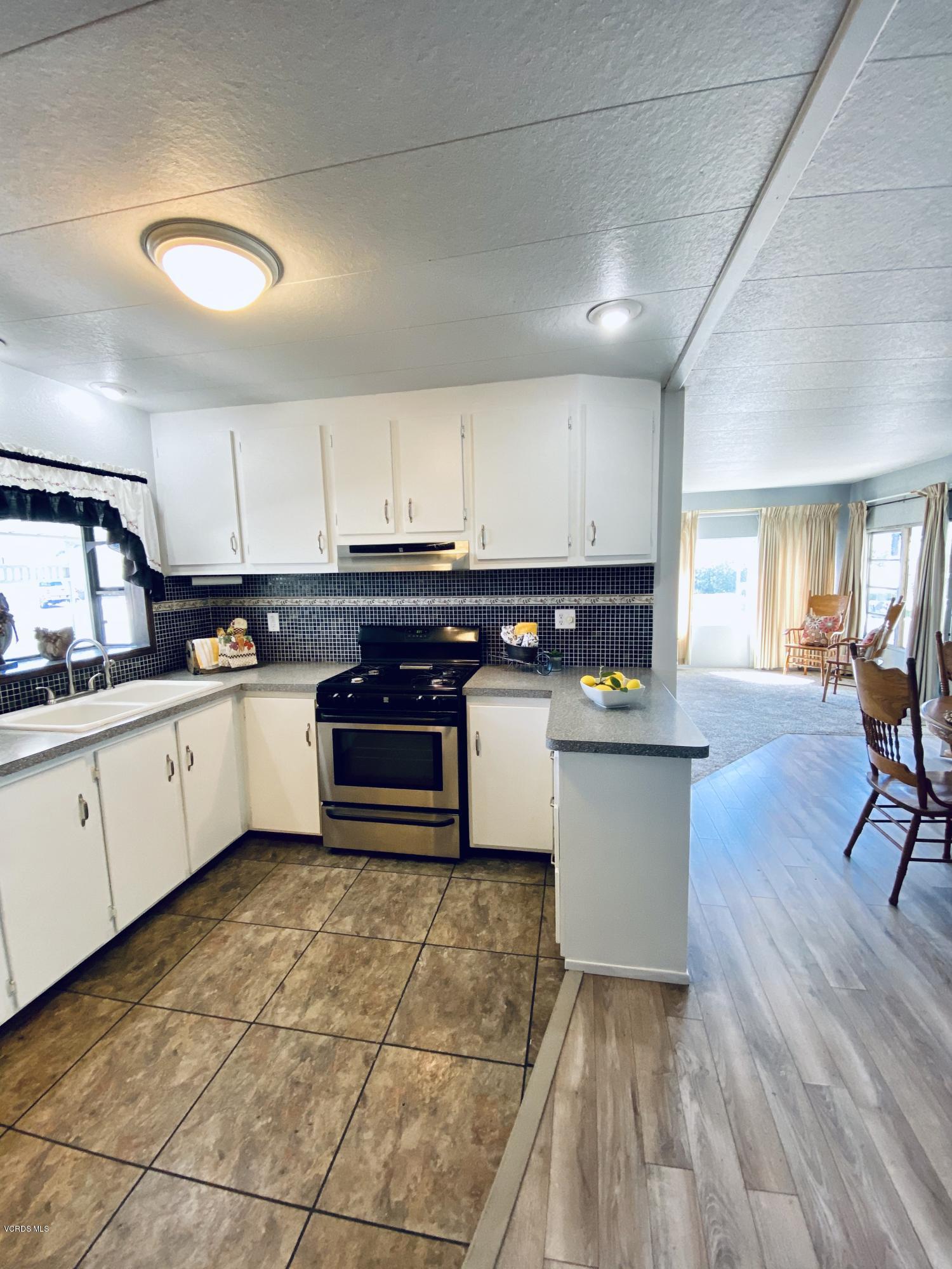 15433 West Telegraph Road, Unit 4 Santa Paula, CA 93060 - Photo 1 of 52 a kitchen with stainless steel appliances granite countertop a stove a sink dishwasher and a refrigerator