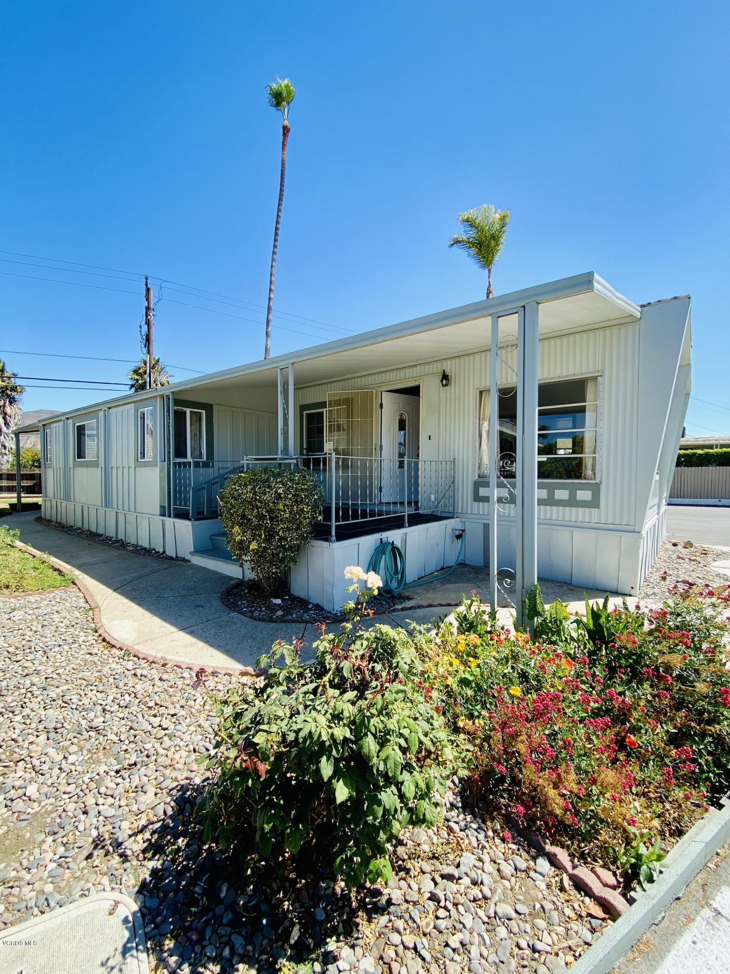 15433 West Telegraph Road, Unit 4 Santa Paula, CA 93060 - Photo 2 of 52 a front view of a house with a yard and fountain
