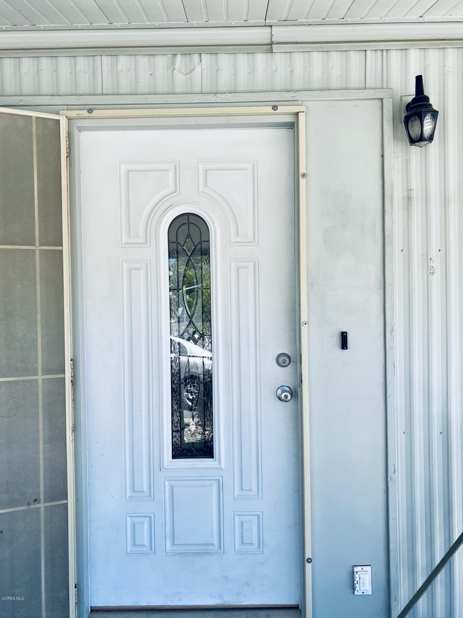 15433 West Telegraph Road, Unit 4 Santa Paula, CA 93060 - Photo 11 of 52 a front view of a house with a glass door