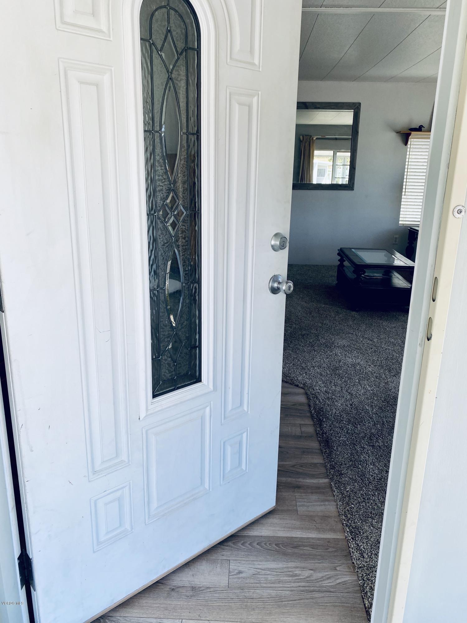 15433 West Telegraph Road, Unit 4 Santa Paula, CA 93060 - Photo 12 of 52 a view of a hallway with wooden floor and staircase