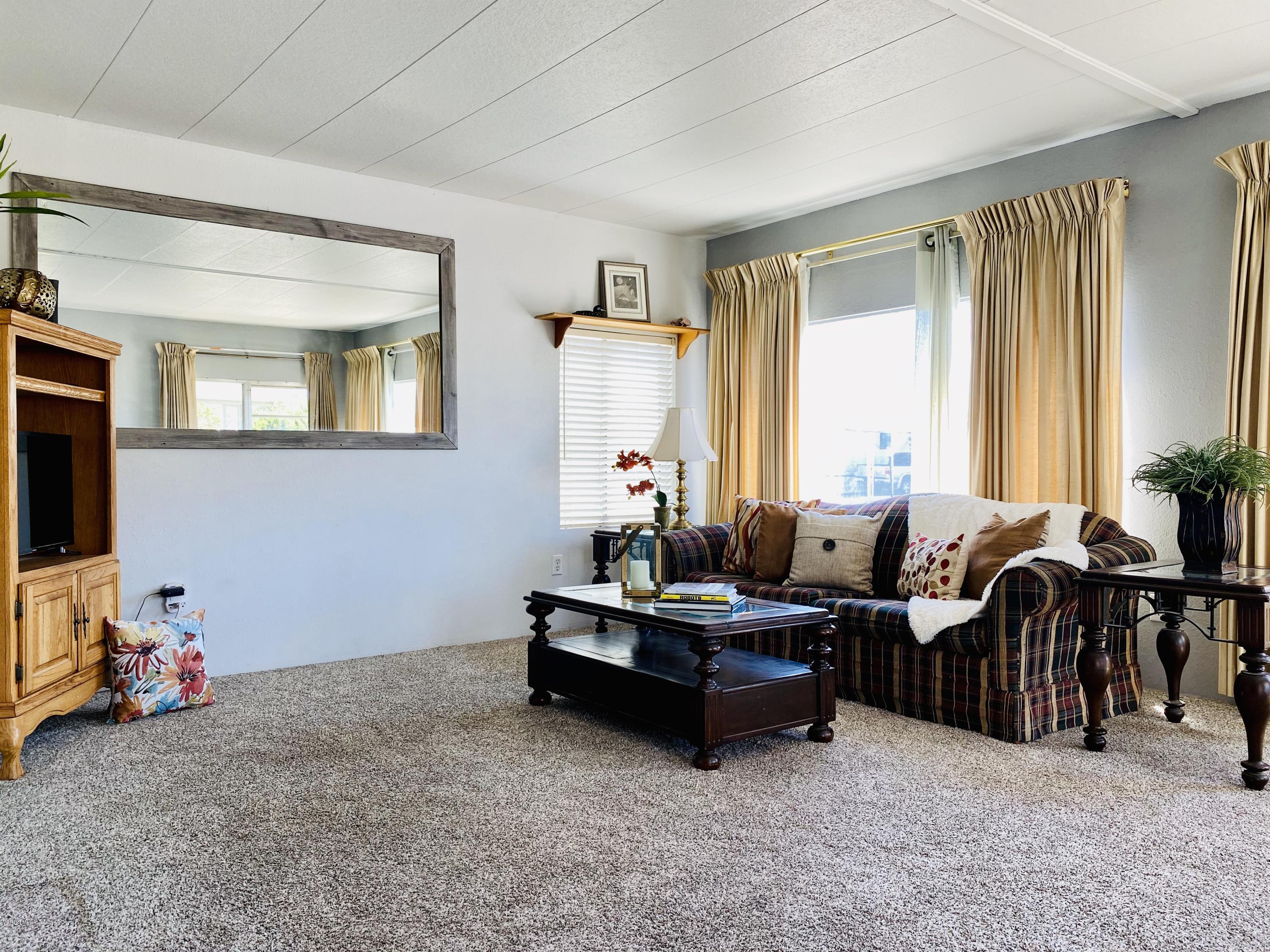 15433 West Telegraph Road, Unit 4 Santa Paula, CA 93060 - Photo 14 of 52 a living room with furniture and a flat screen tv