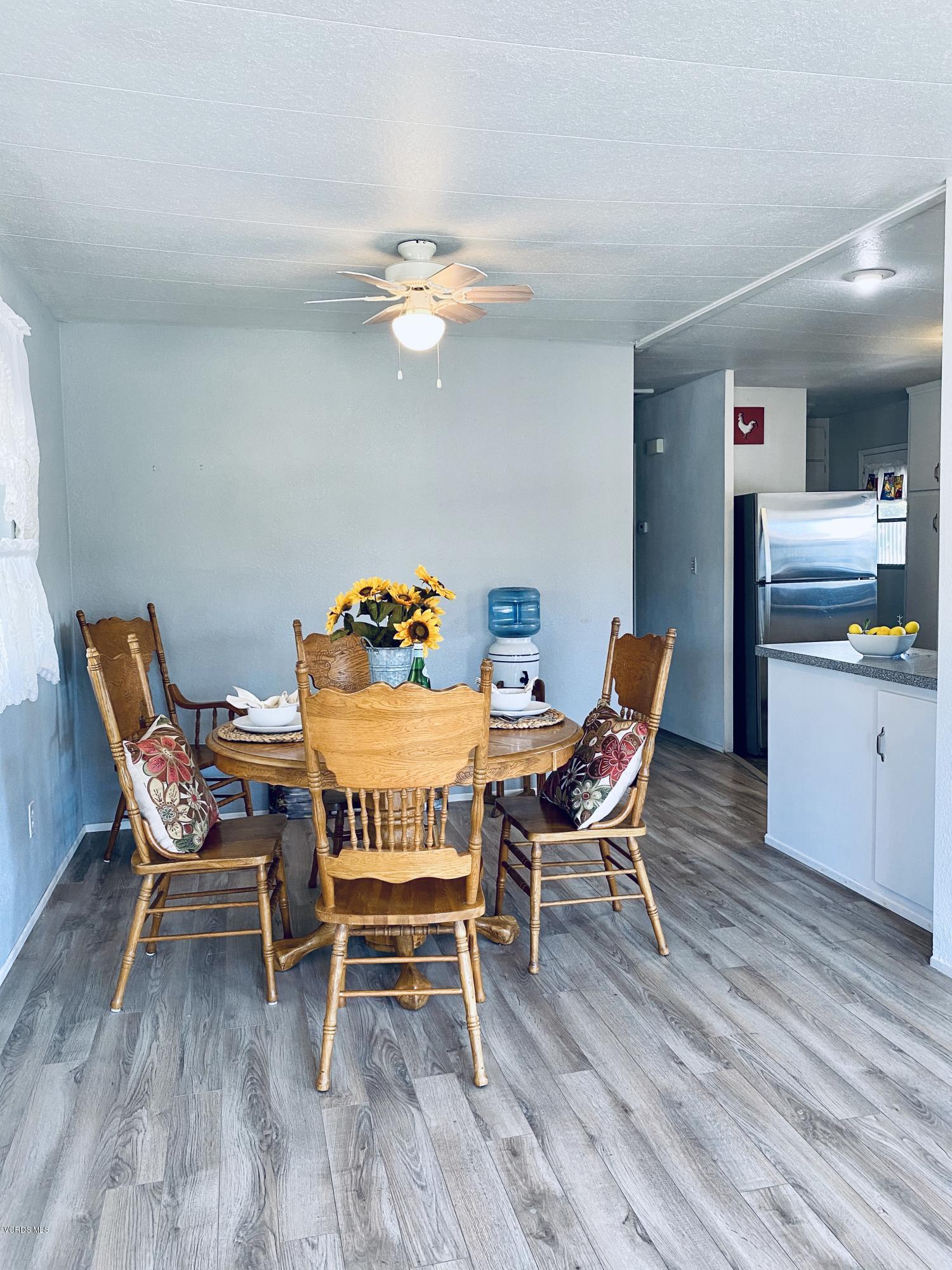 15433 West Telegraph Road, Unit 4 Santa Paula, CA 93060 - Photo 19 of 52 a dining room with furniture and wooden floor