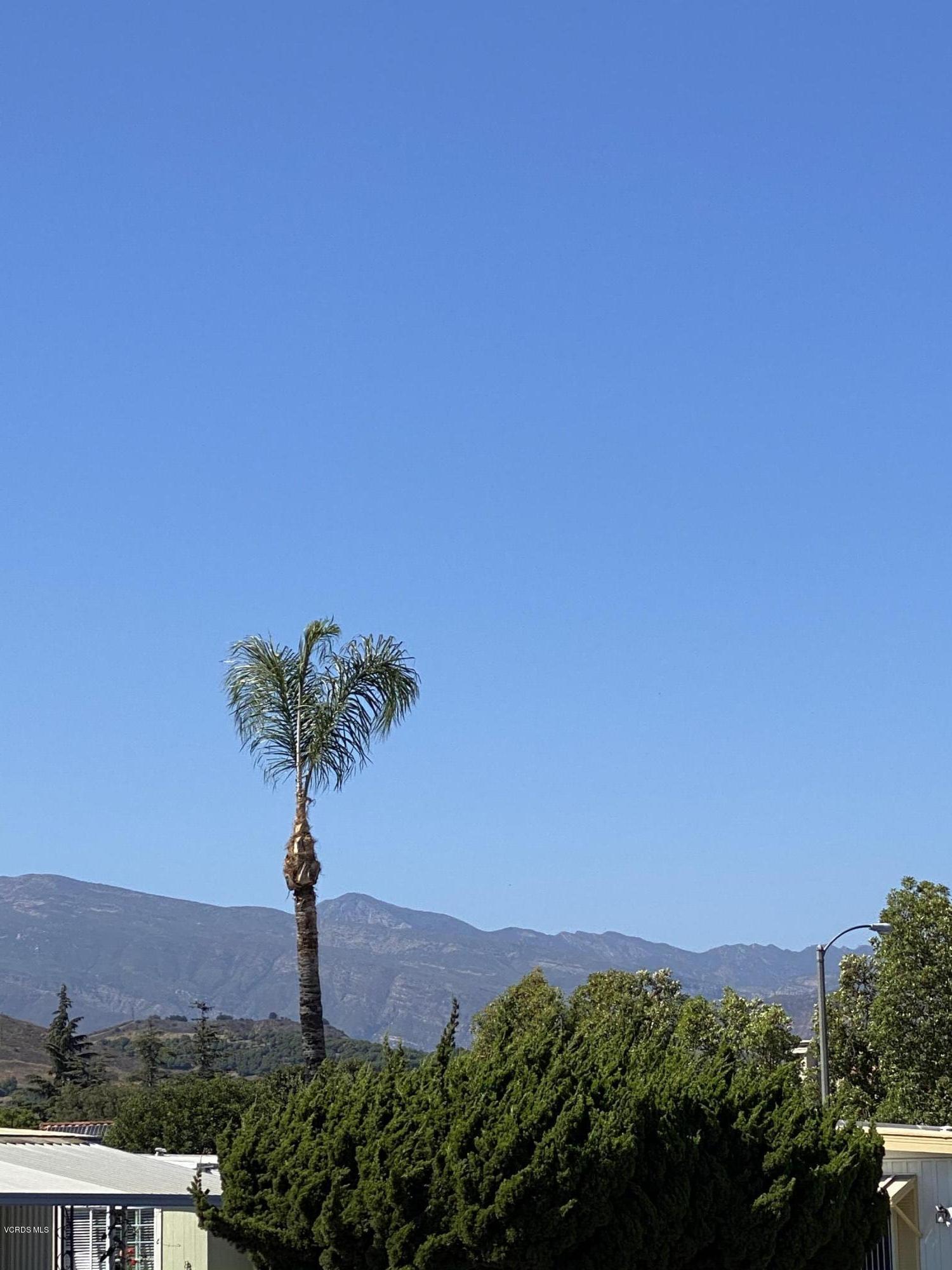 15433 West Telegraph Road, Unit 4 Santa Paula, CA 93060 - Photo 3 of 52 a front view of a house with a yard