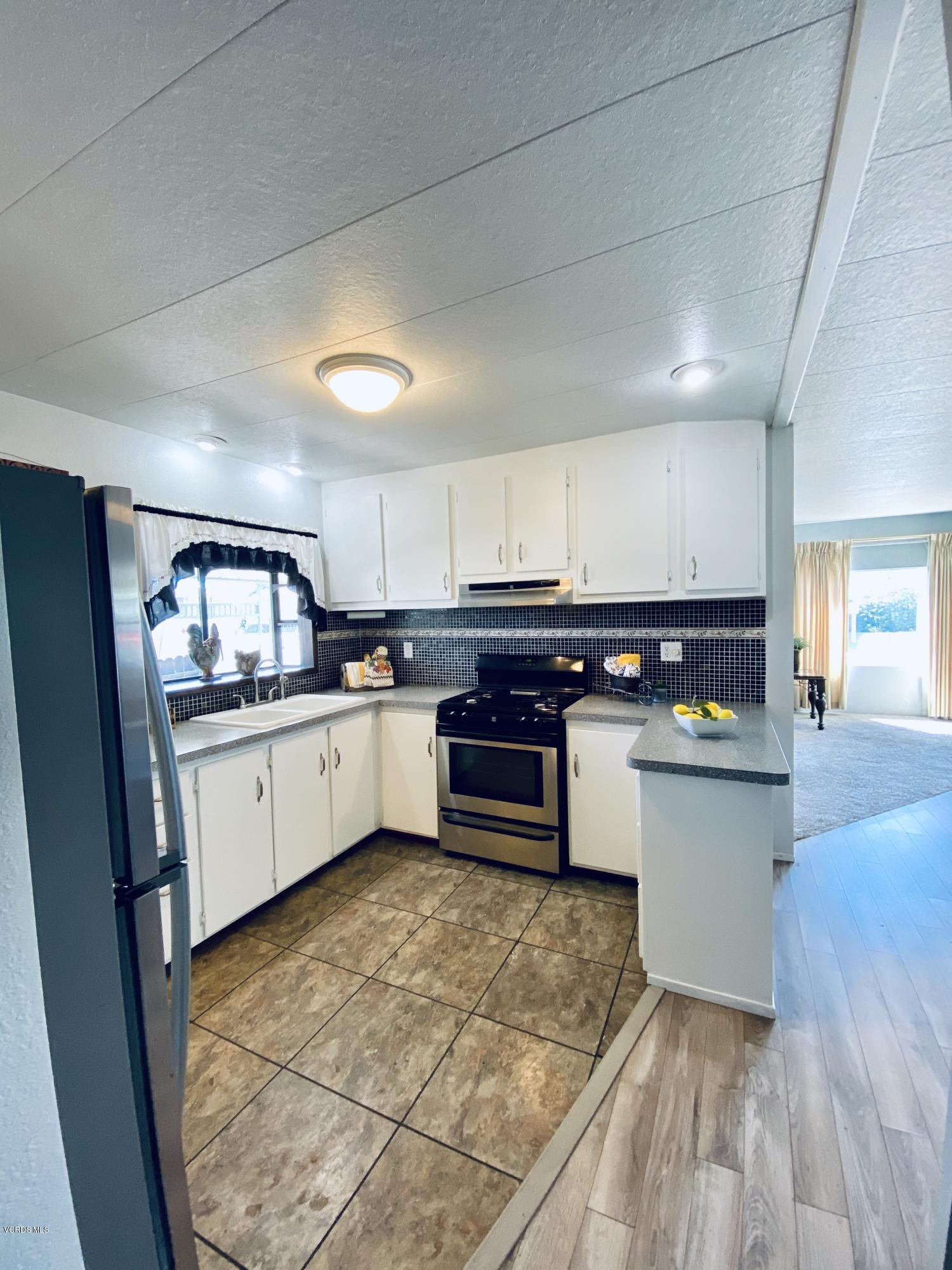 15433 West Telegraph Road, Unit 4 Santa Paula, CA 93060 - Photo 25 of 52 a kitchen with stainless steel appliances a stove a sink and a refrigerator
