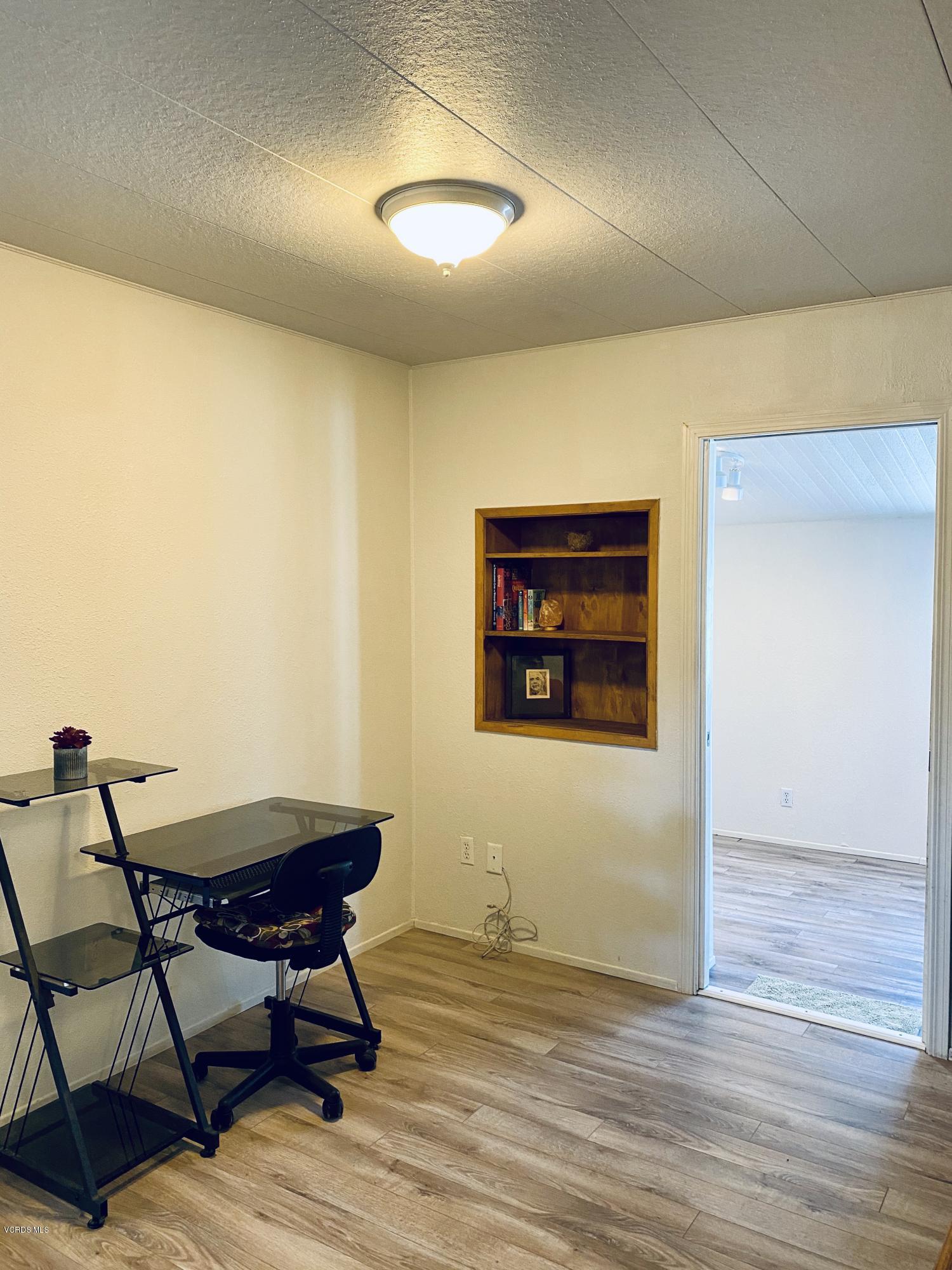 15433 West Telegraph Road, Unit 4 Santa Paula, CA 93060 - Photo 29 of 52 a view of a room with furniture and wooden floor
