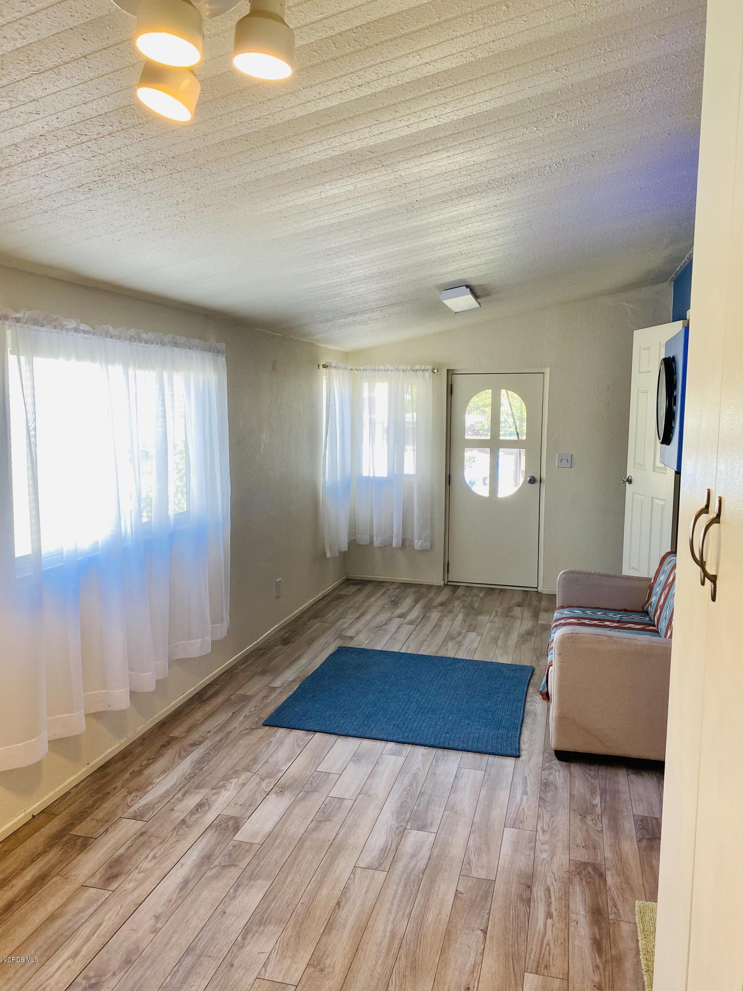 15433 West Telegraph Road, Unit 4 Santa Paula, CA 93060 - Photo 30 of 52 a view of a livingroom with wooden floor and window