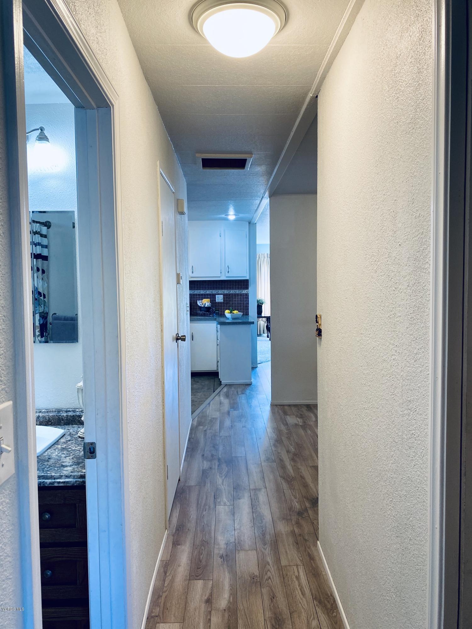 15433 West Telegraph Road, Unit 4 Santa Paula, CA 93060 - Photo 32 of 52 a view of a kitchen cabinets and a wooden floor