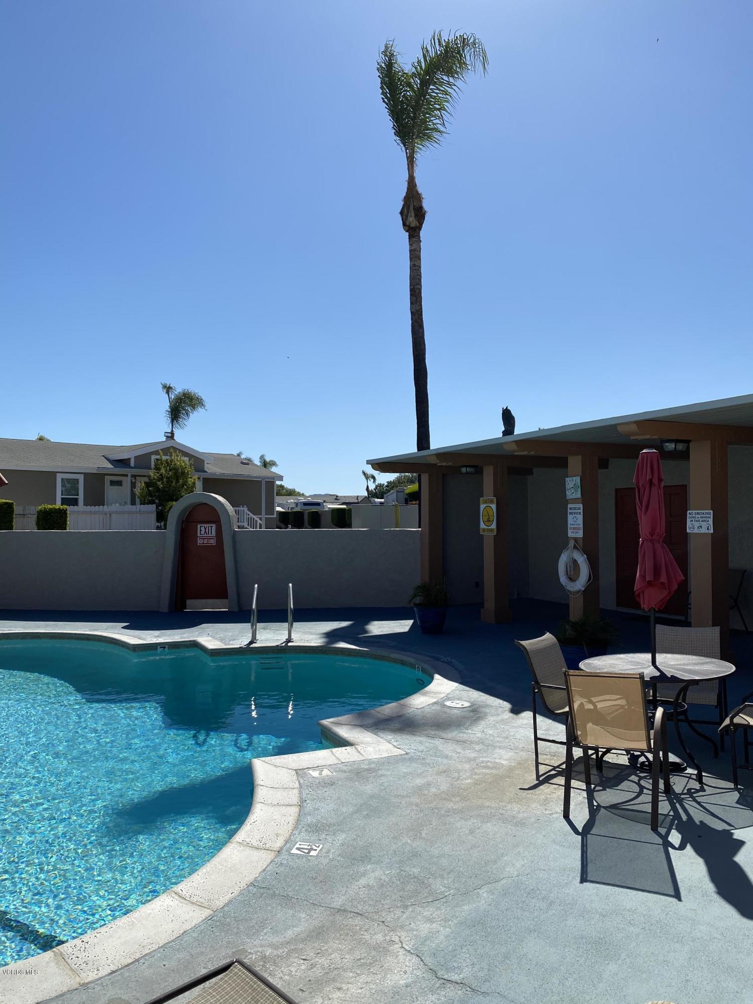 15433 West Telegraph Road, Unit 4 Santa Paula, CA 93060 - Photo 50 of 52 a roof deck with table and chairs a barbeque