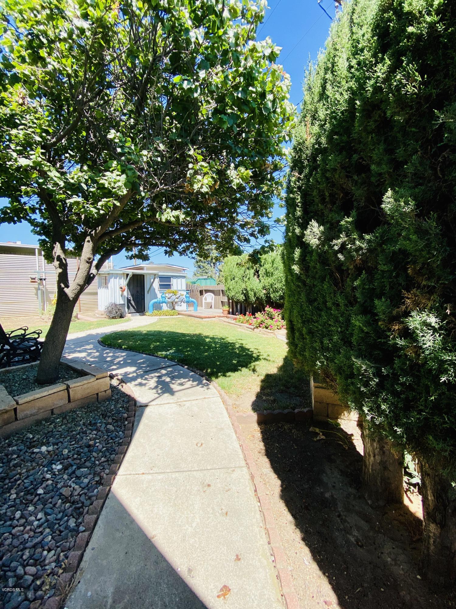 15433 West Telegraph Road, Unit 4 Santa Paula, CA 93060 - Photo 7 of 52 a view of a pathway with a yard