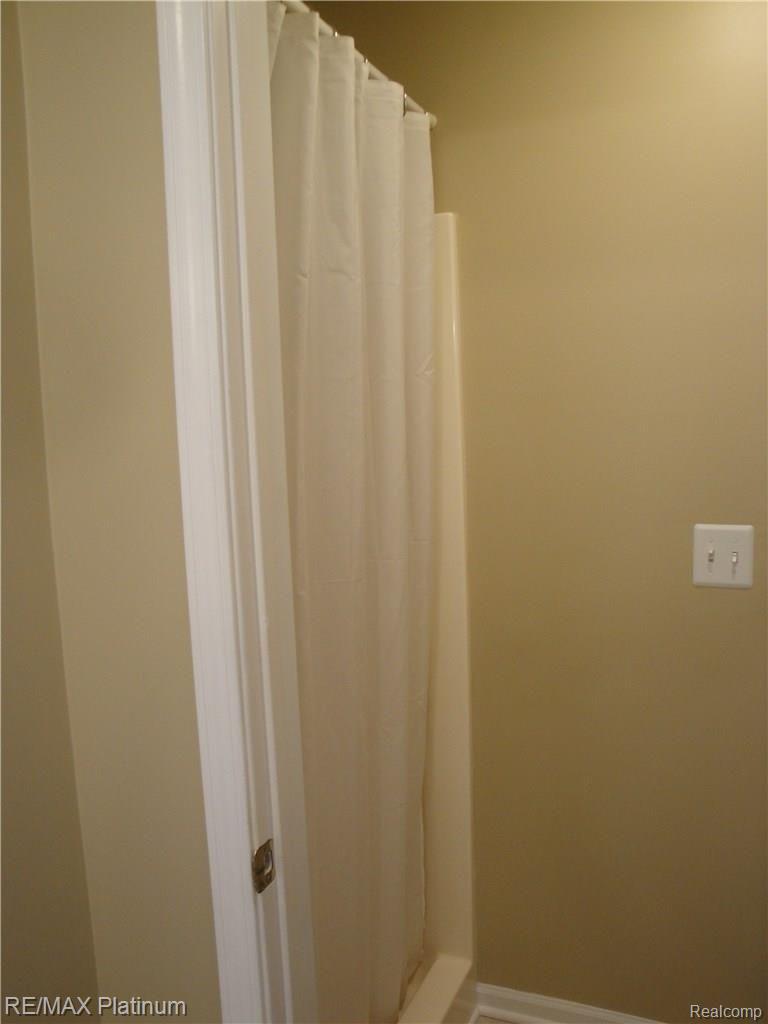 1201 Oakcrest Road Howell, MI 48843 - Photo 32 of 57 Full shower in bedroom #1 bath