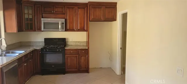 a kitchen with a refrigerator and cabinets