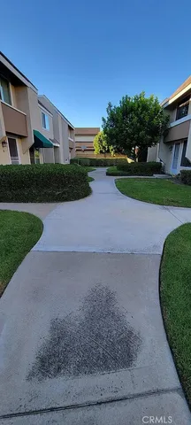 a view of house with backyard and deck