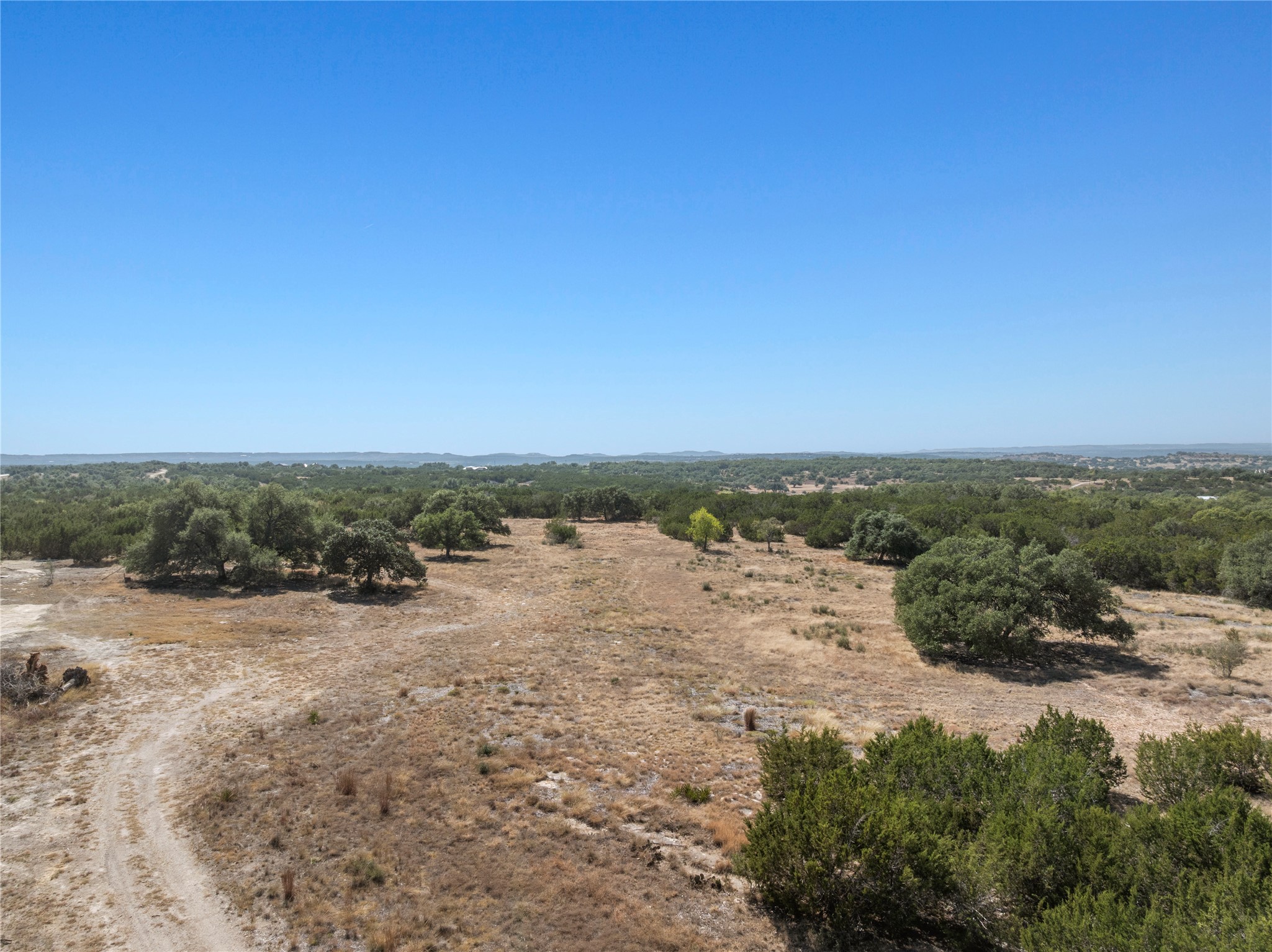 219 Canyon Road Johnson City, TX 78636 - Photo 2 of 9 a view of a beach with a ocean view