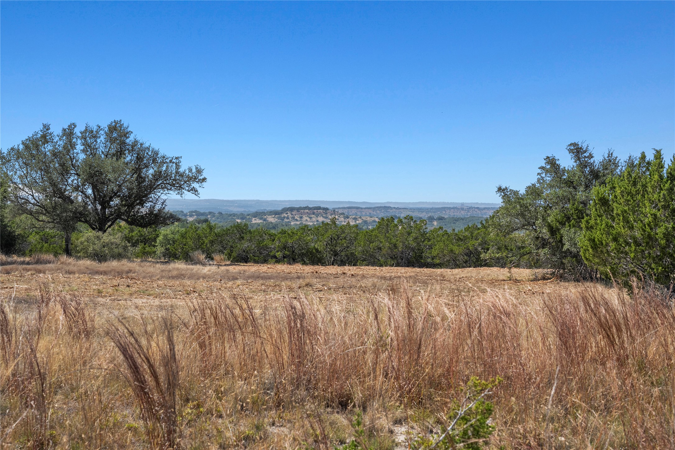 219 Canyon Road Johnson City, TX 78636 - Photo 5 of 9 a view of a lake and mountain view