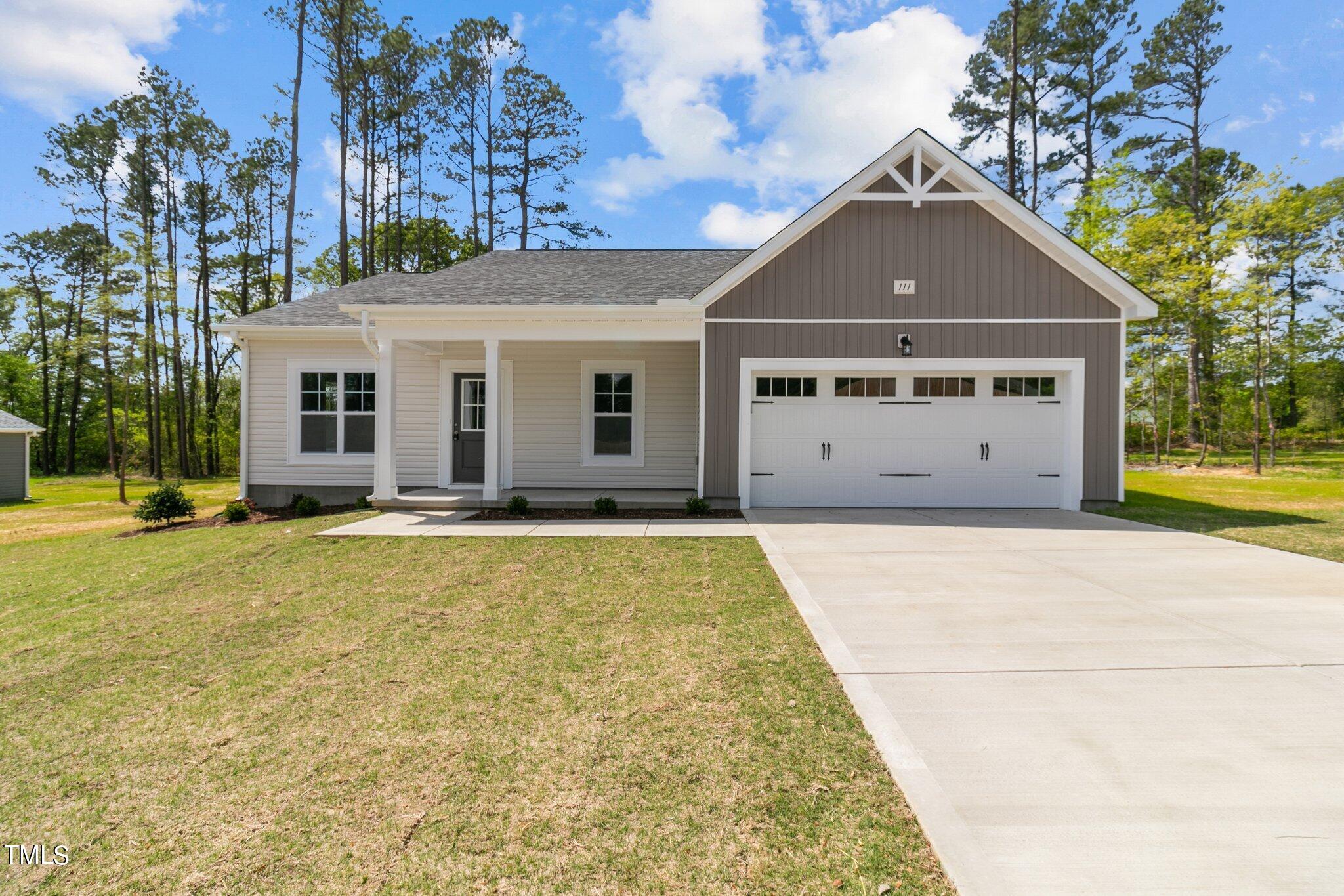 111 Regis Lane Coats, NC 27521 - Photo 1 of 36 a view of a house with a yard
